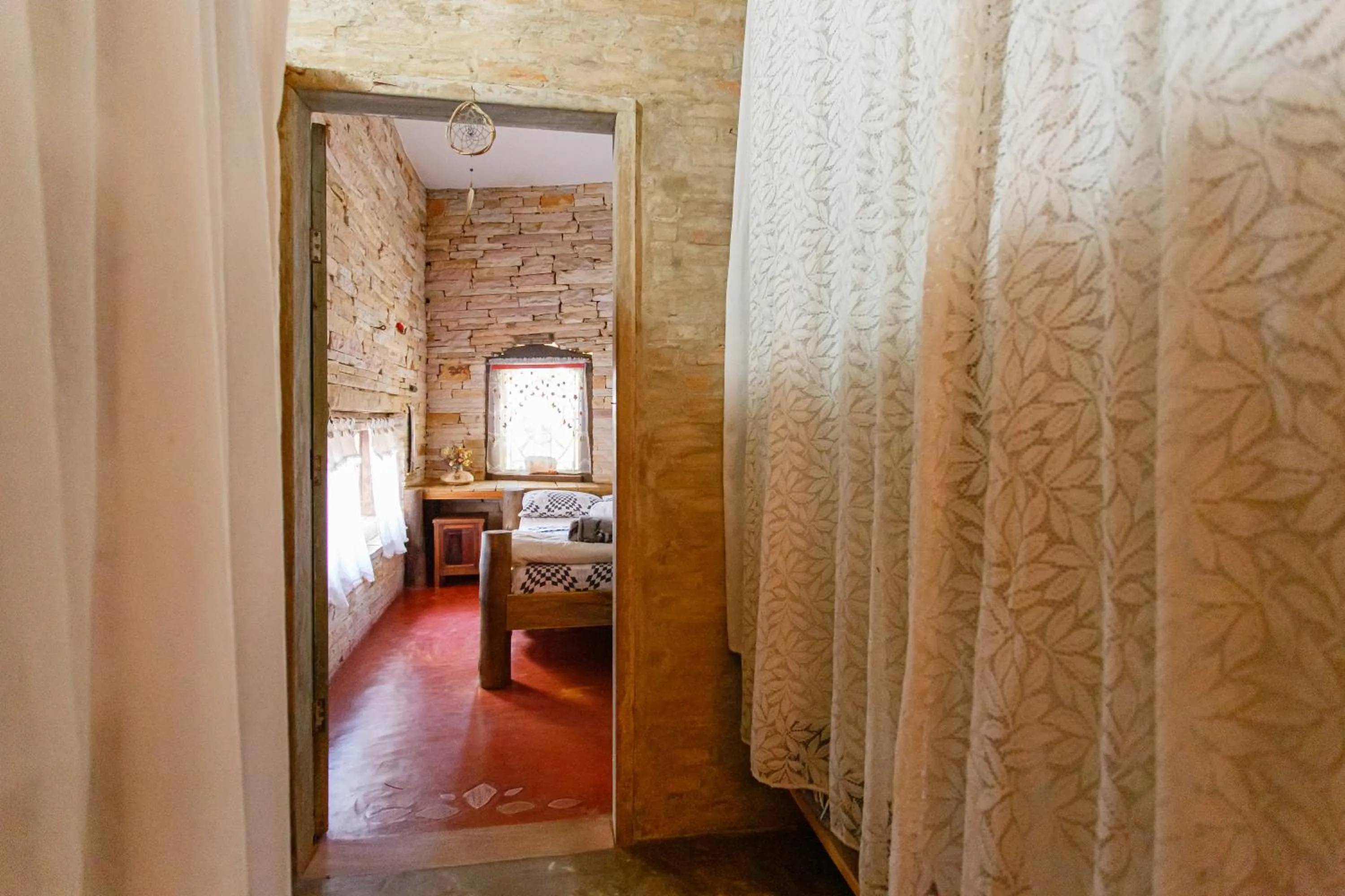 Bed in Chalé de Pedra - Hospedaria