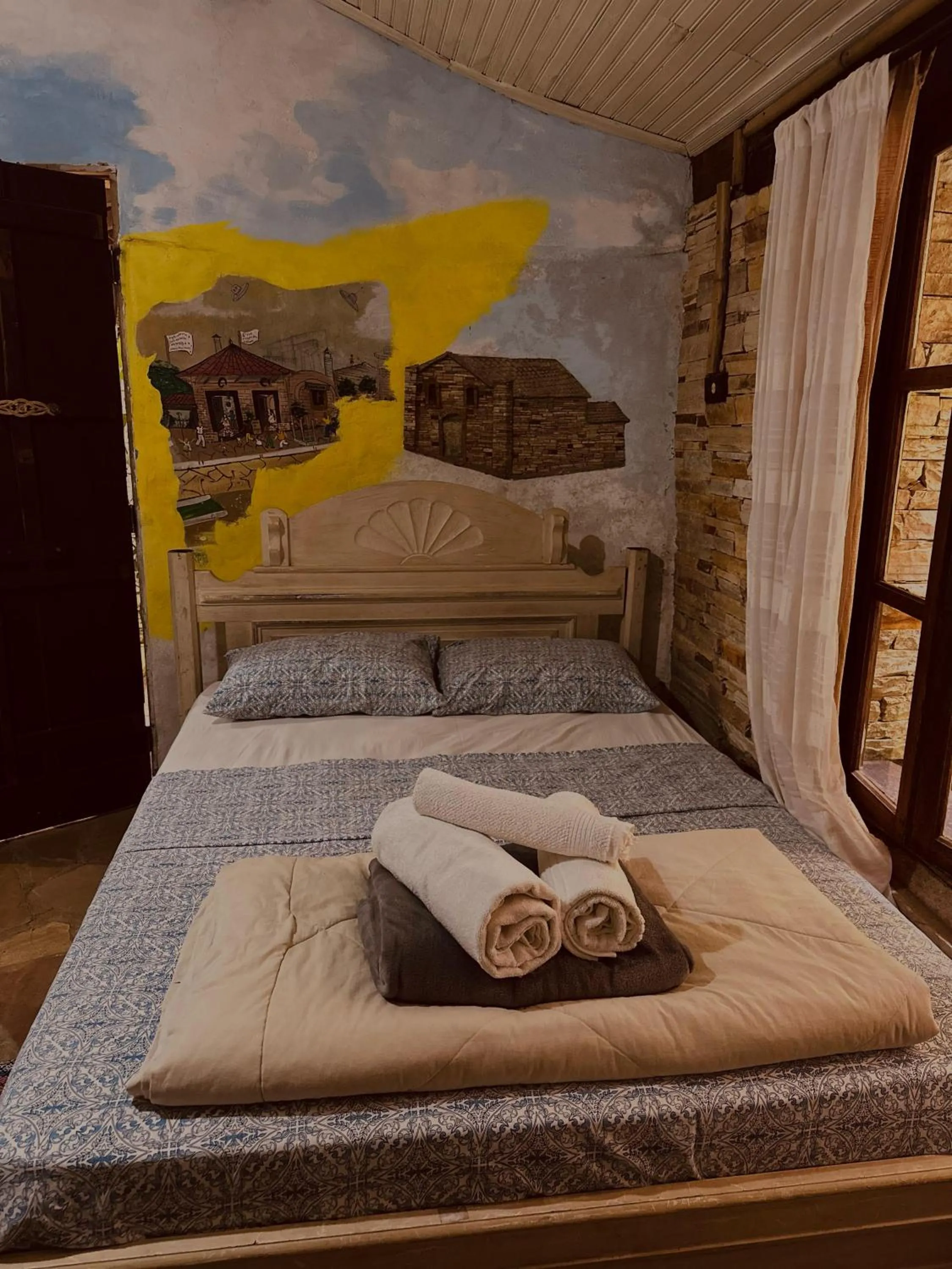 Bed in Chalé de Pedra - Hospedaria