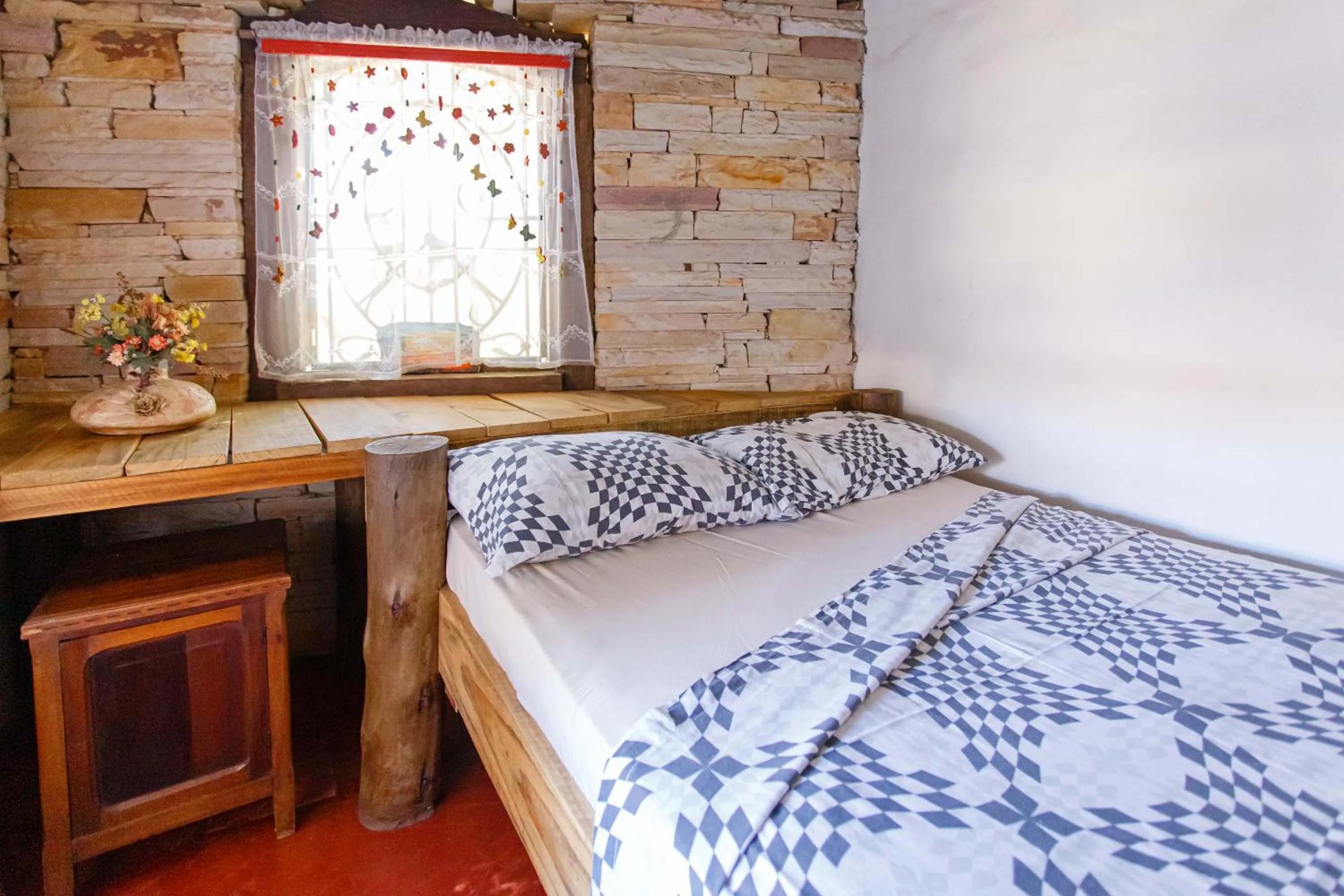 Bed in Chalé de Pedra - Hospedaria