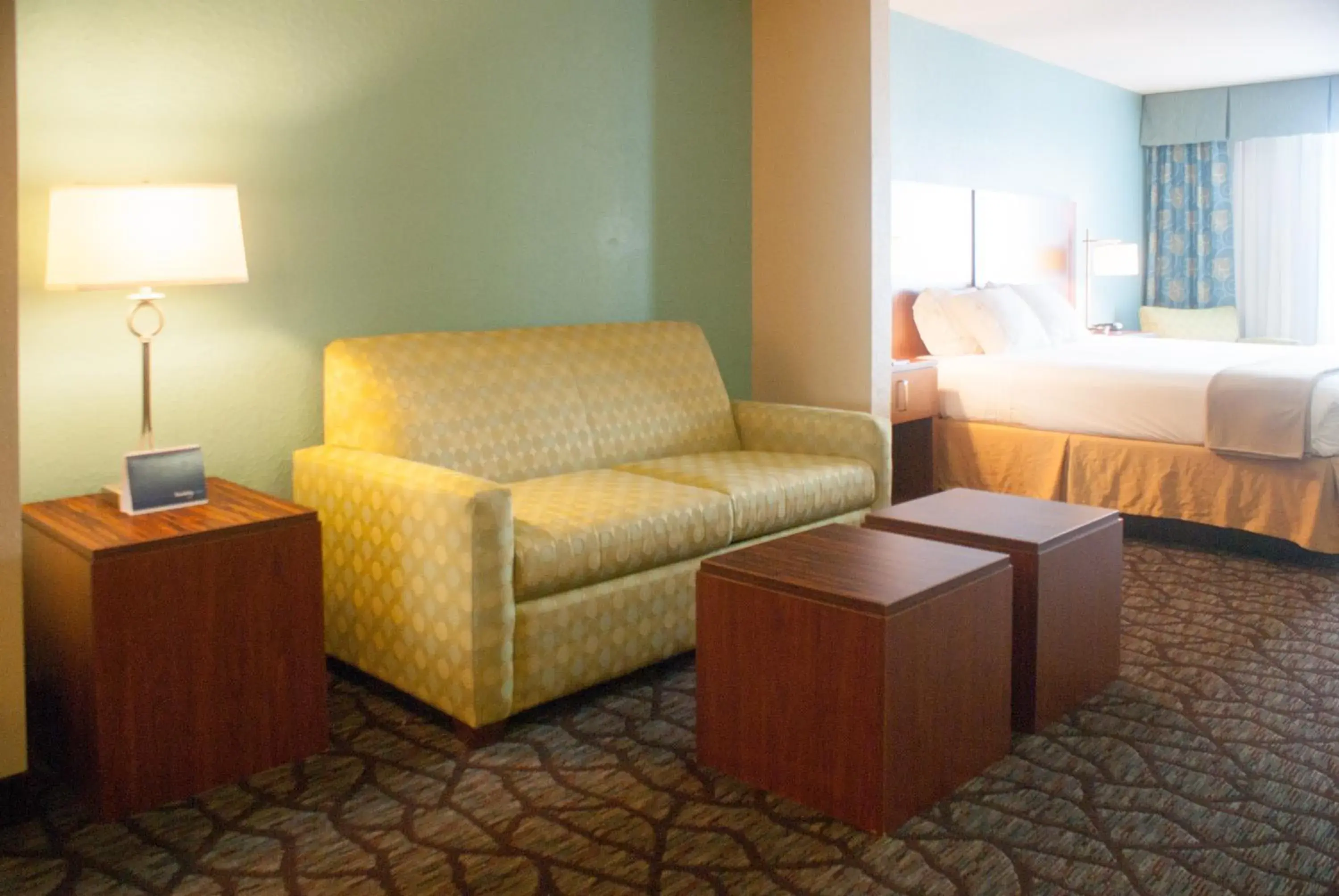 Living room, Bed in Holiday Inn Express & Suites Jacksonville South - I-295 by IHG Living room, Bed in Holiday Inn Express & Suites Jacksonville South - I-295 by IHG