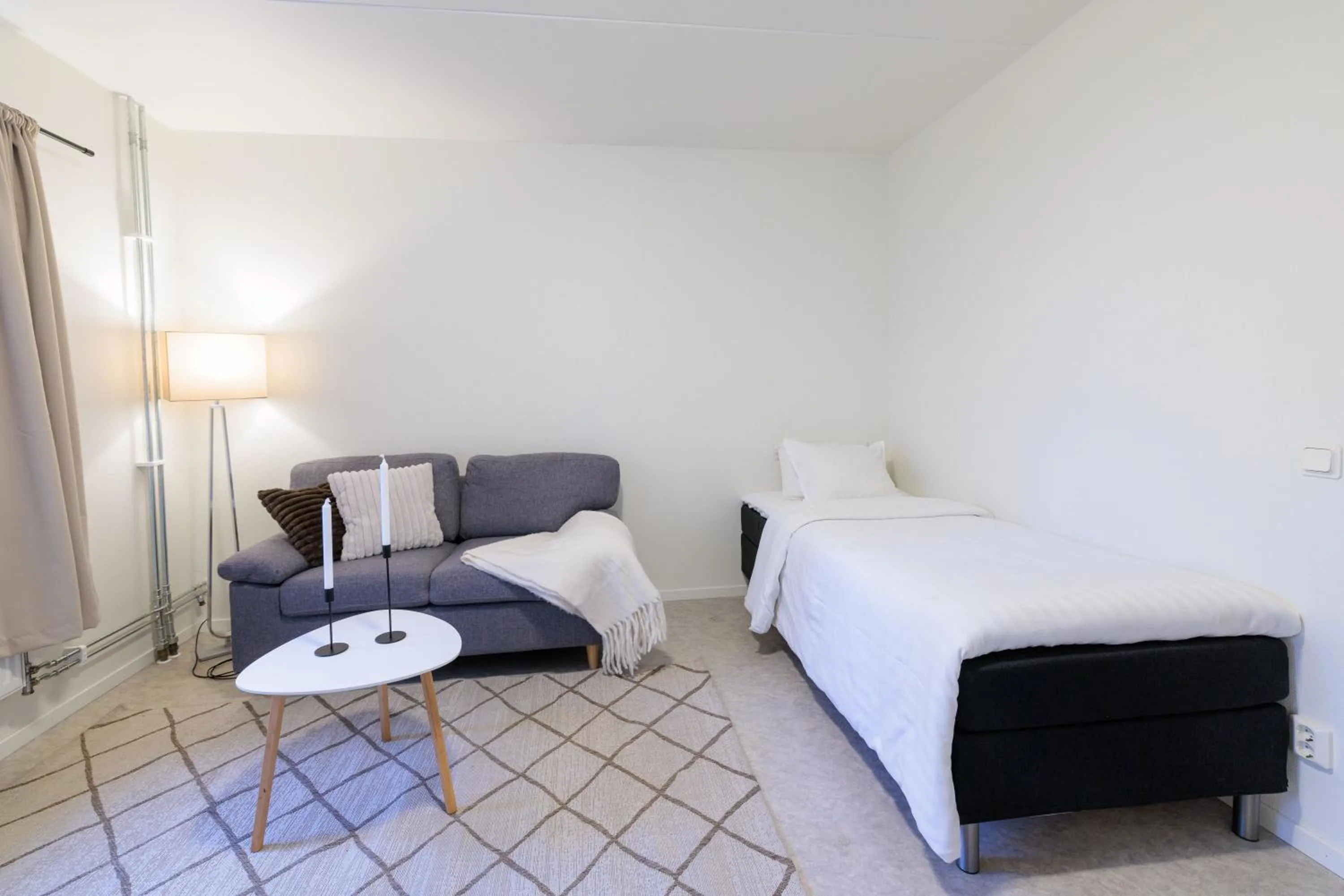 Bed in Easy Livin' Apartment Hotel