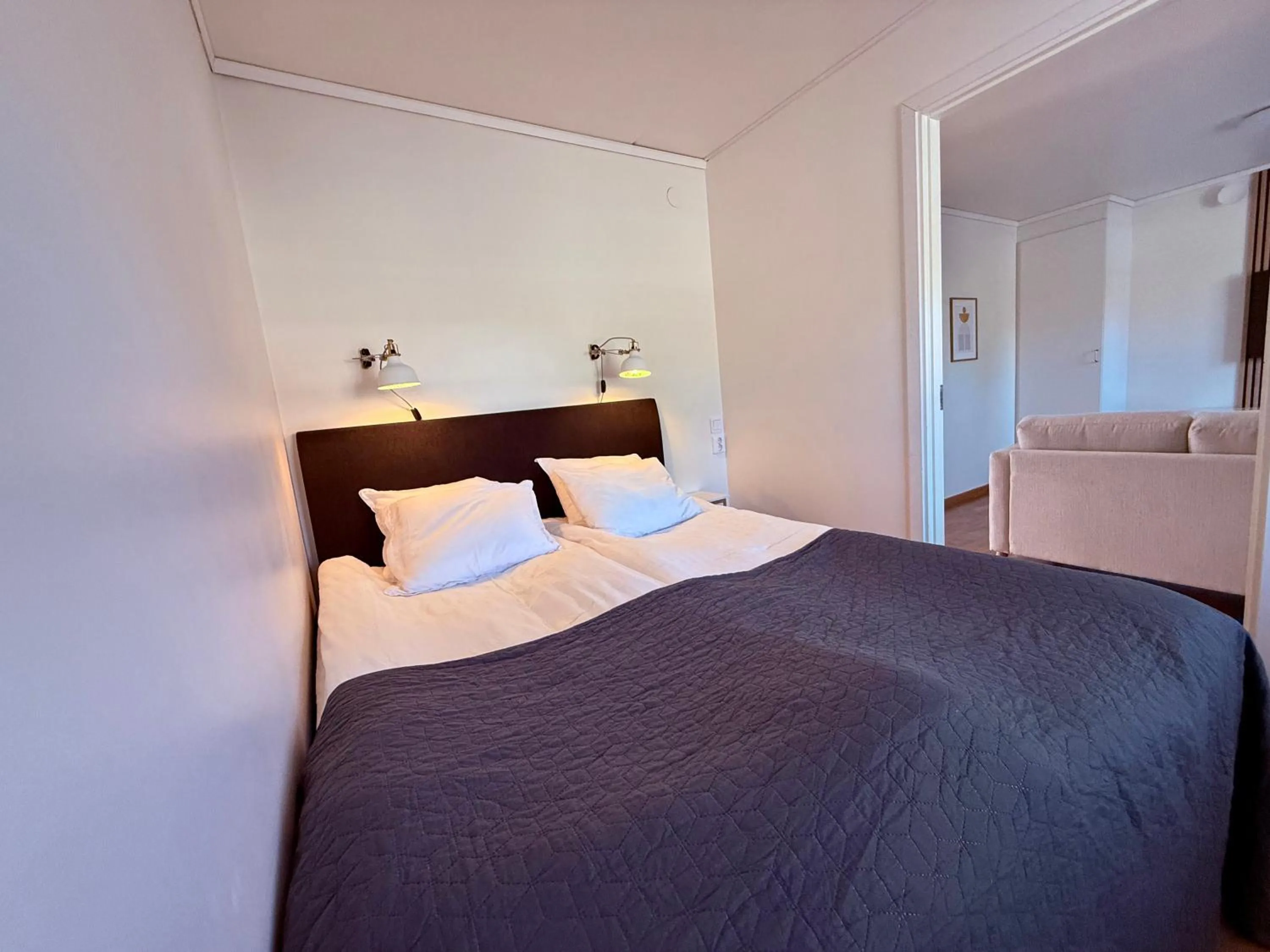 Bed in Easy Livin' Apartment Hotel