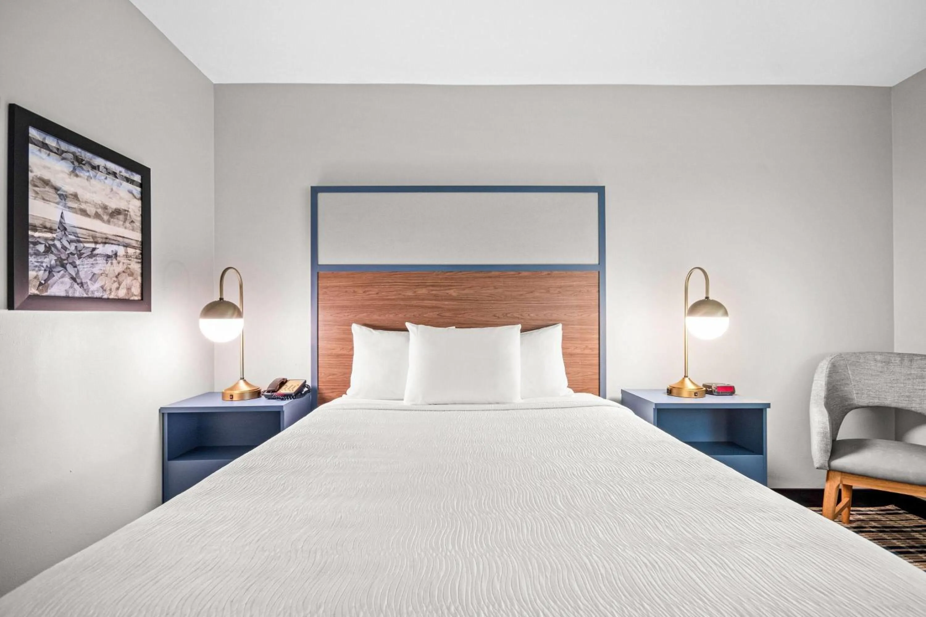 Bed in AmericInn by Wyndham Beloit