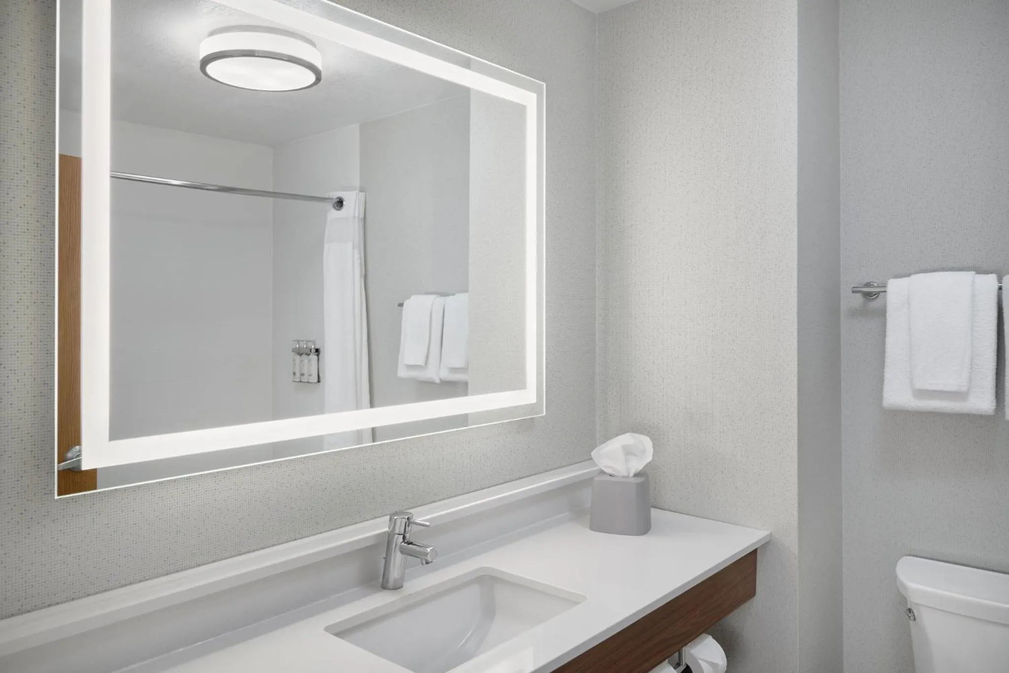 Bathroom in Holiday Inn Express Kansas City - at the Legends! by IHG