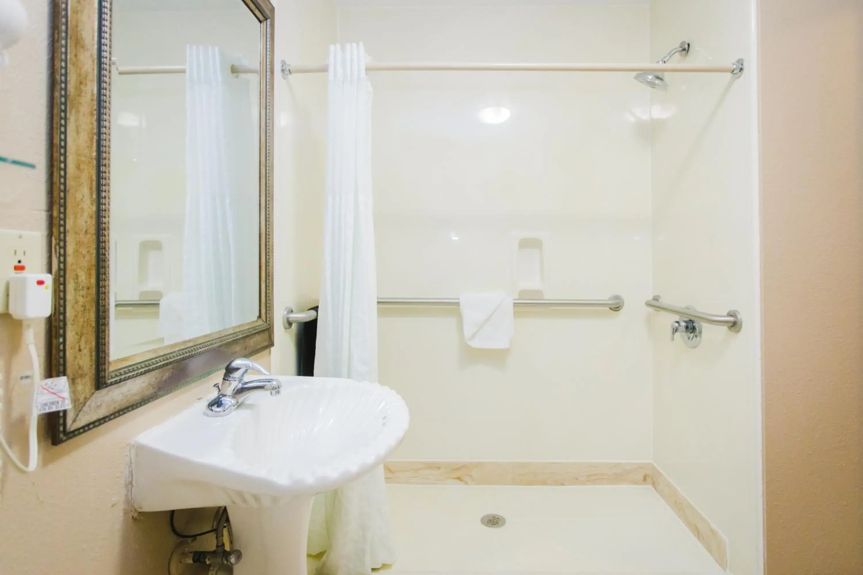 Bathroom in Days Inn by Wyndham Rosenberg Bathroom in Days Inn by Wyndham Rosenberg