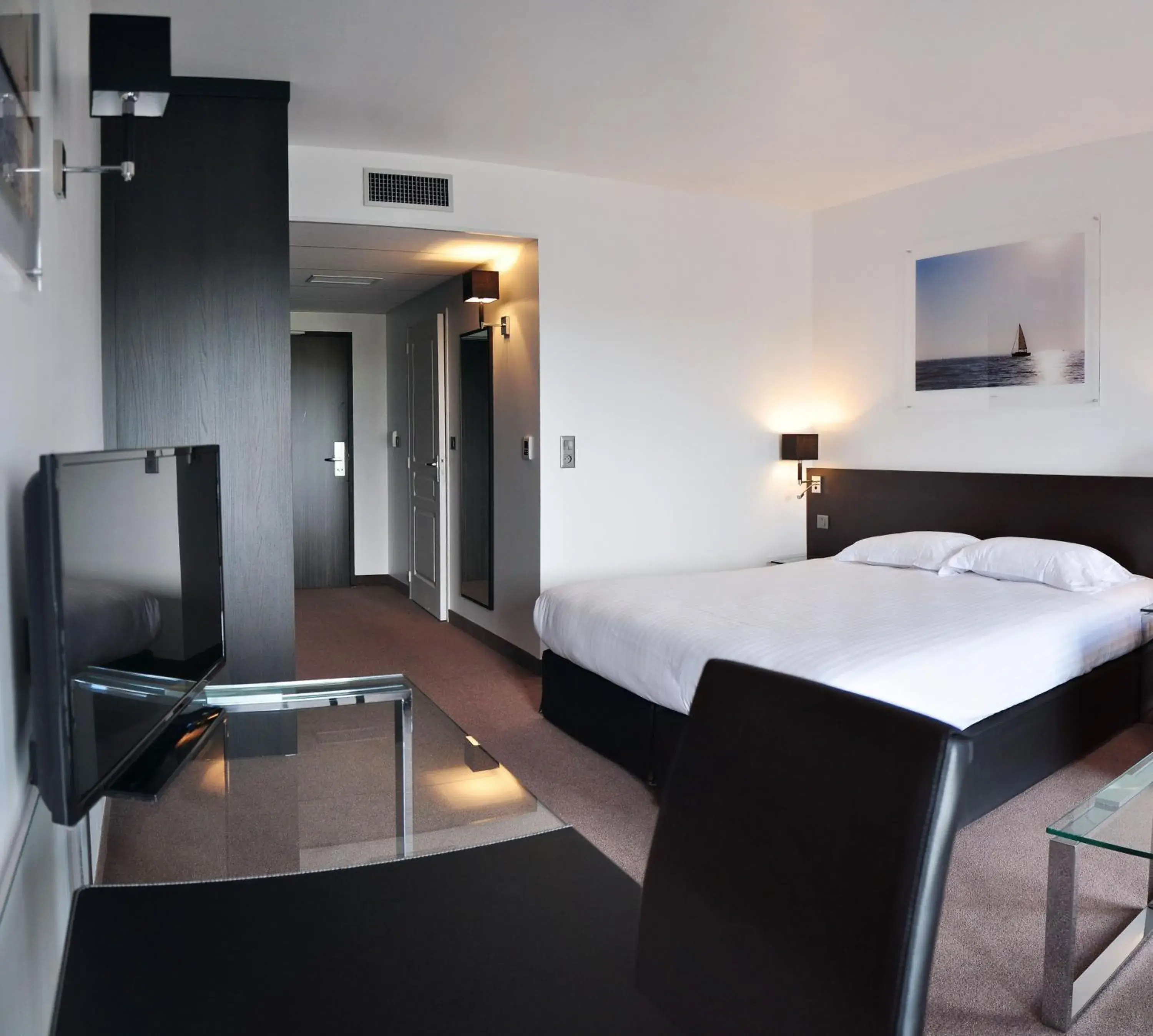 Photo of the whole room, Bed in Golden Tulip Pornic Suites- Appart Hotel Photo of the whole room, Bed in Golden Tulip Pornic Suites- Appart Hotel