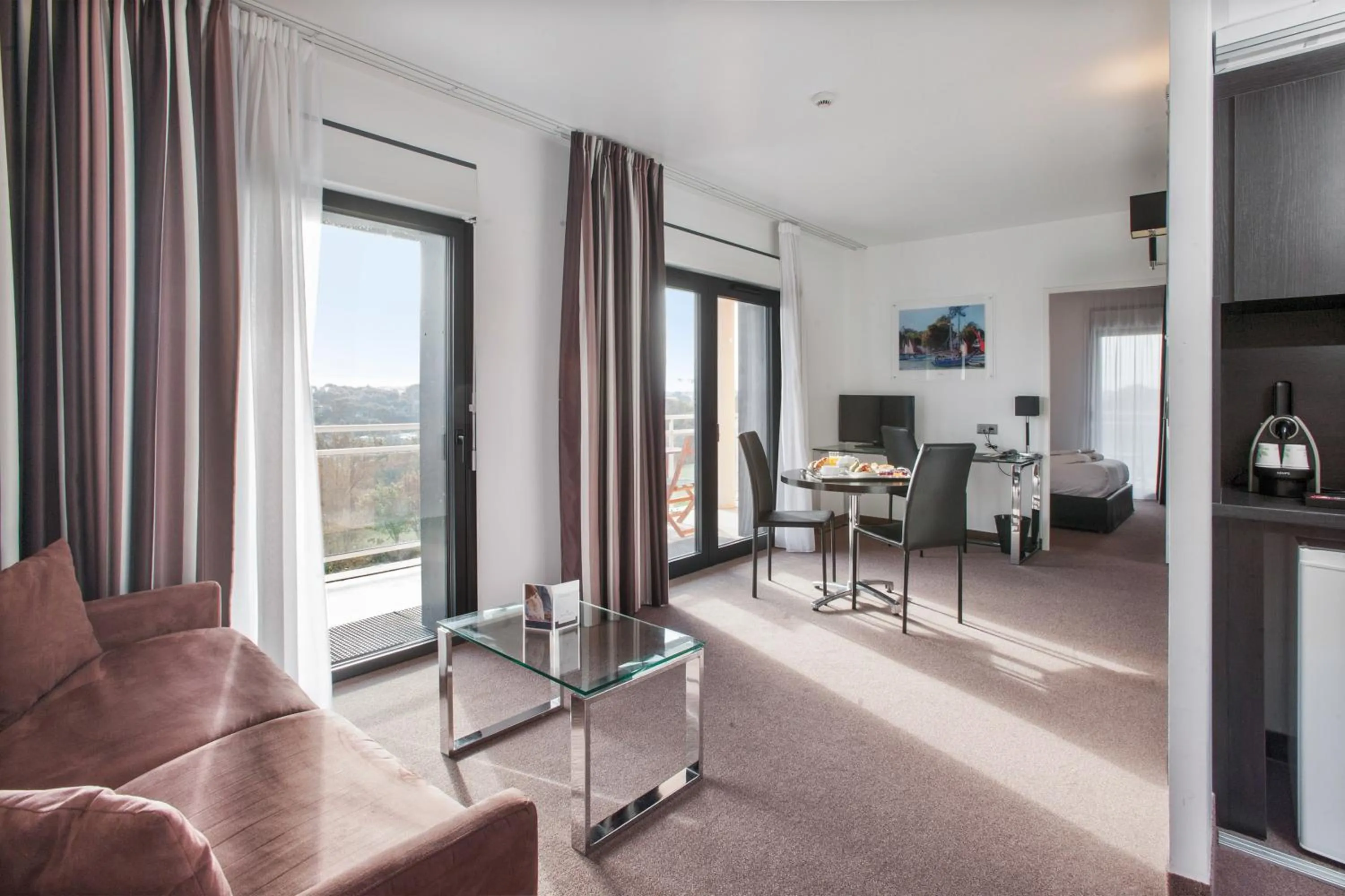 Seating area in Golden Tulip Pornic Suites- Appart Hotel