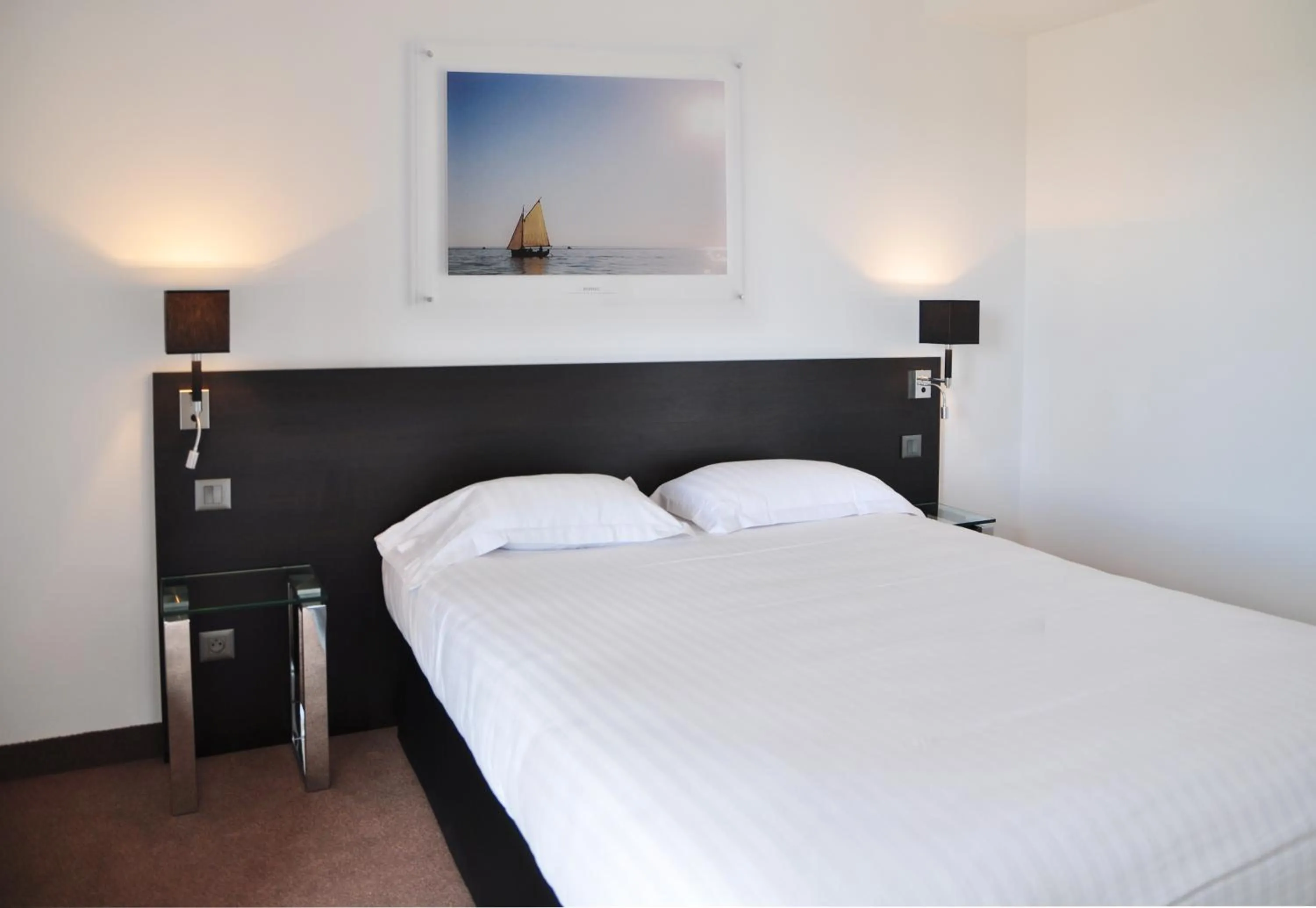 Bed in Golden Tulip Pornic Suites- Appart Hotel