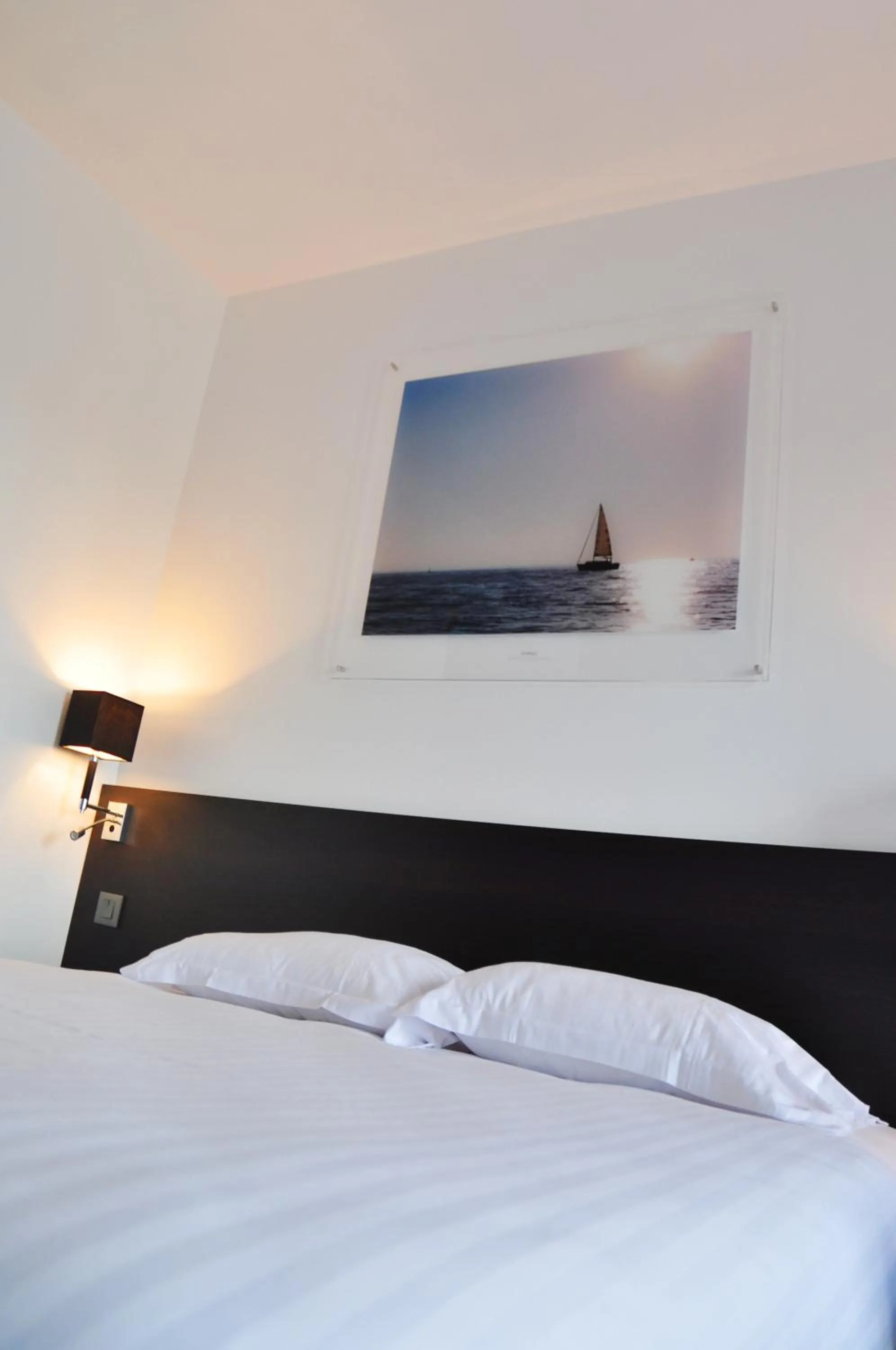 Photo of the whole room, Bed in Golden Tulip Pornic Suites- Appart Hotel