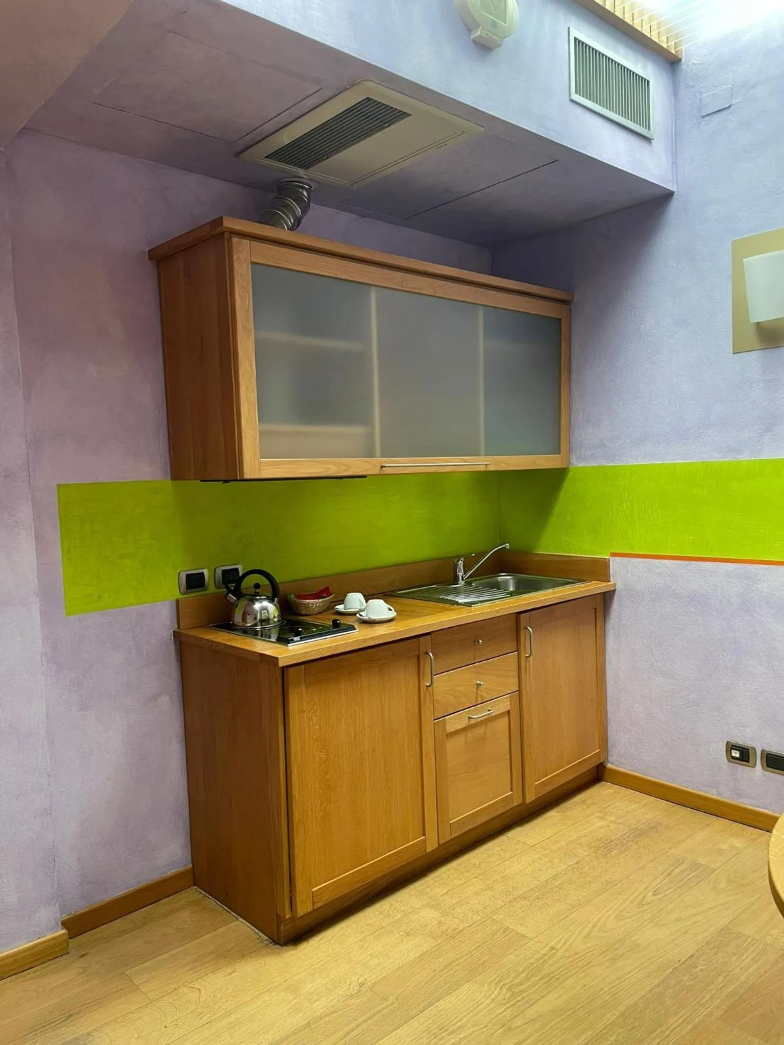 Kitchen or kitchenette in Appartamenti Porta Nuova 80