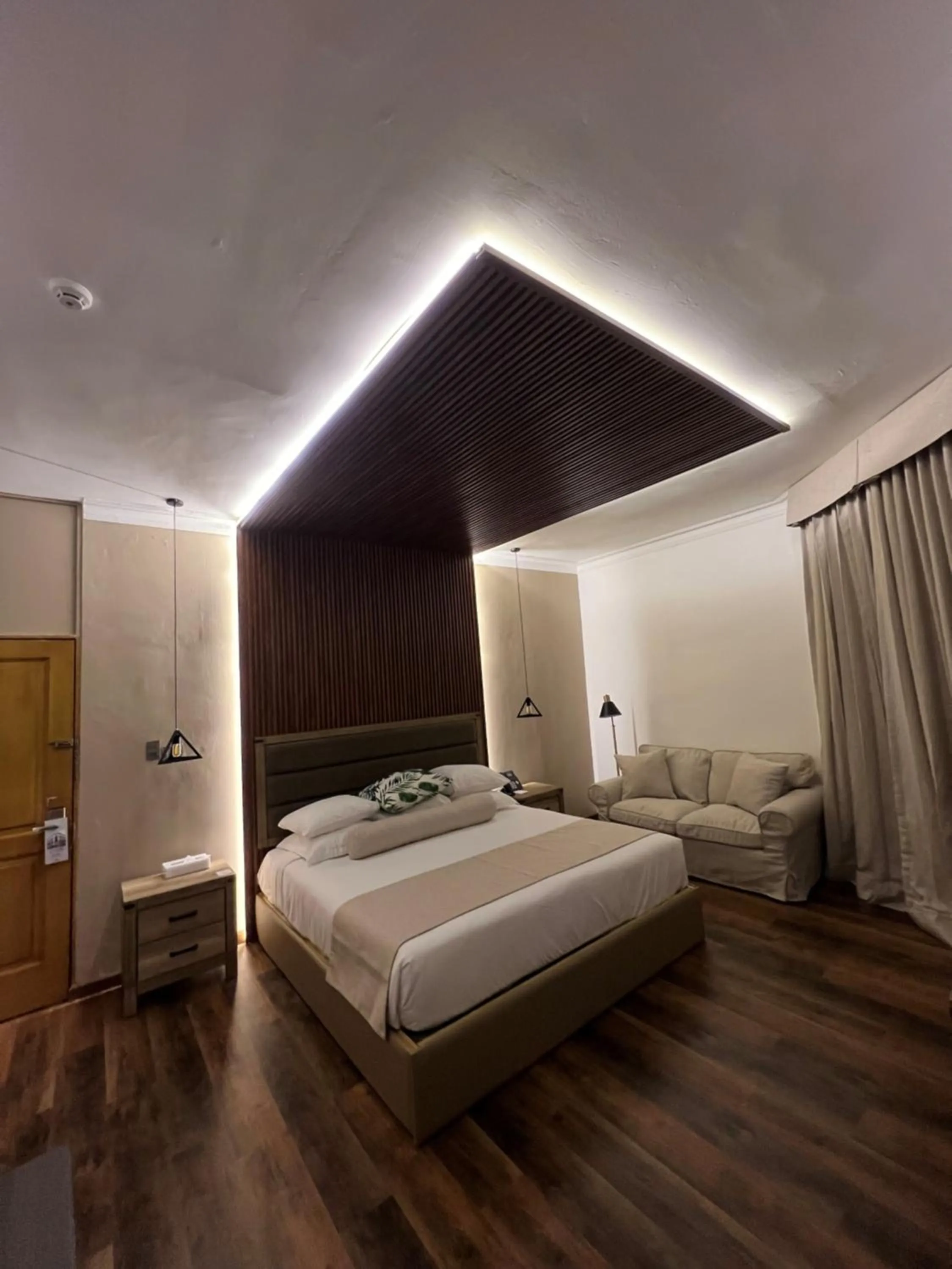 Living room, Bed in Gran Hotel Europa Santo Domingo Trademark Collection by Wyndham