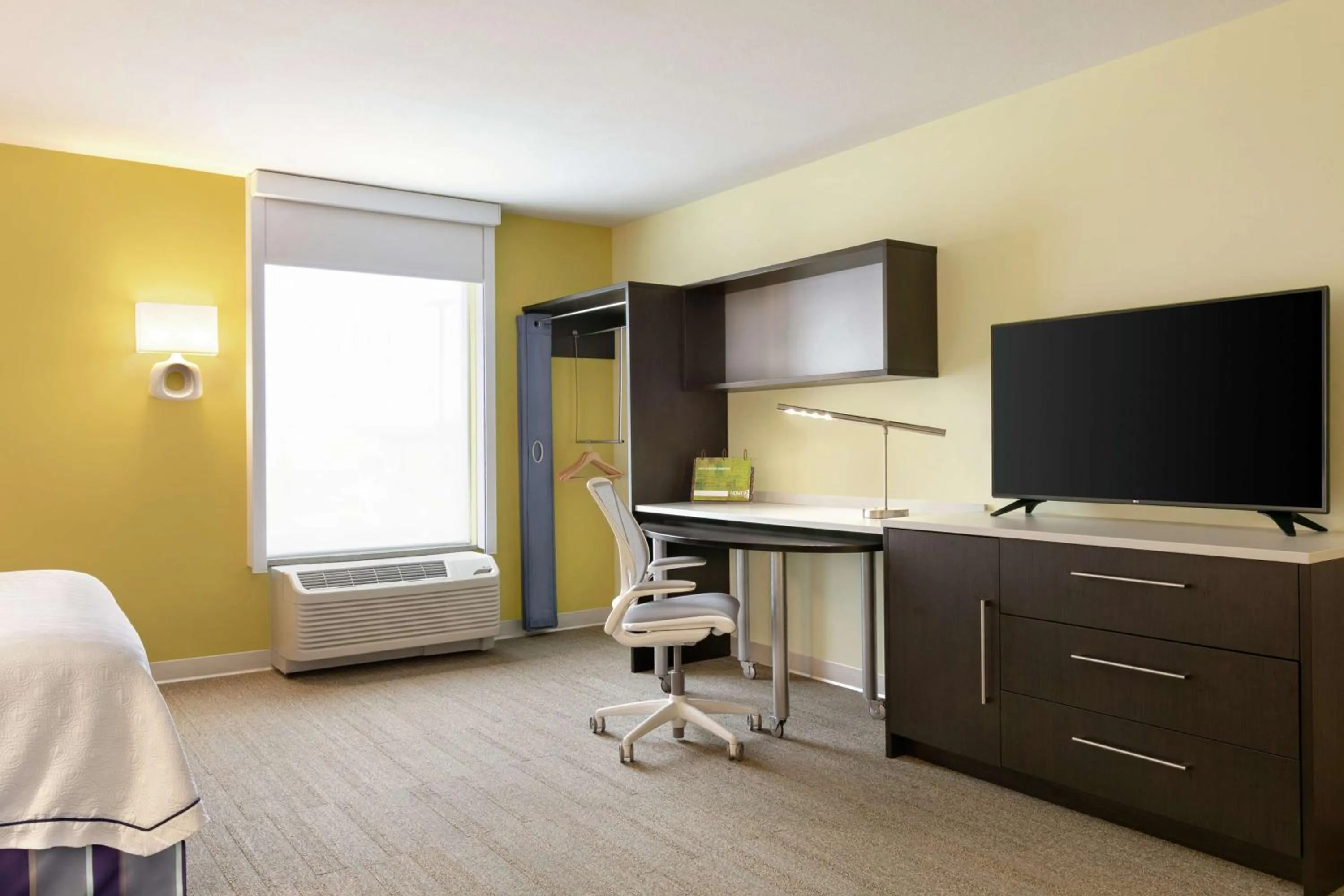 Seating area, Bed in Home2 Suites by Hilton Fort St. John