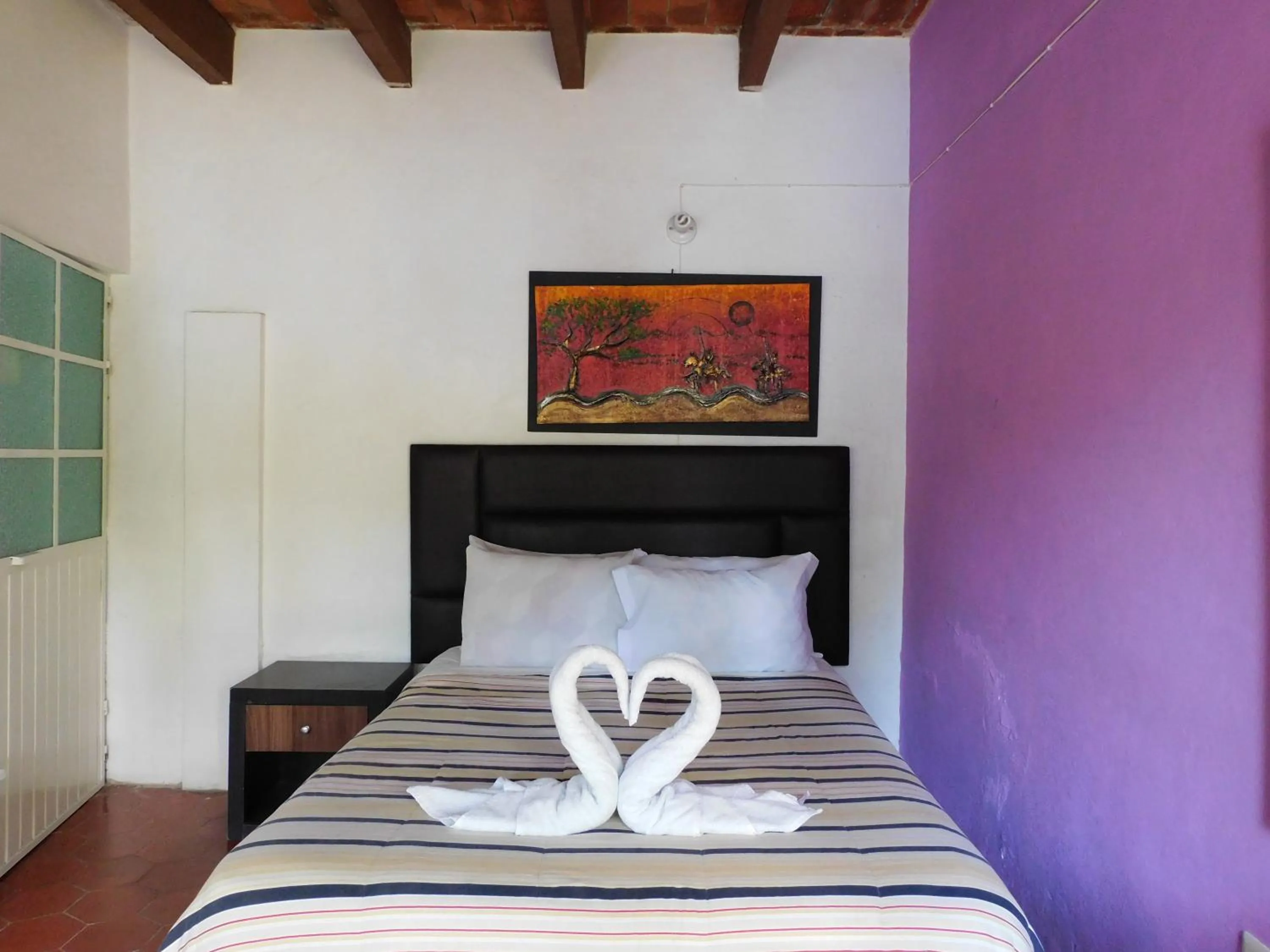 Bed in Hotel Elohim by Rotamundos