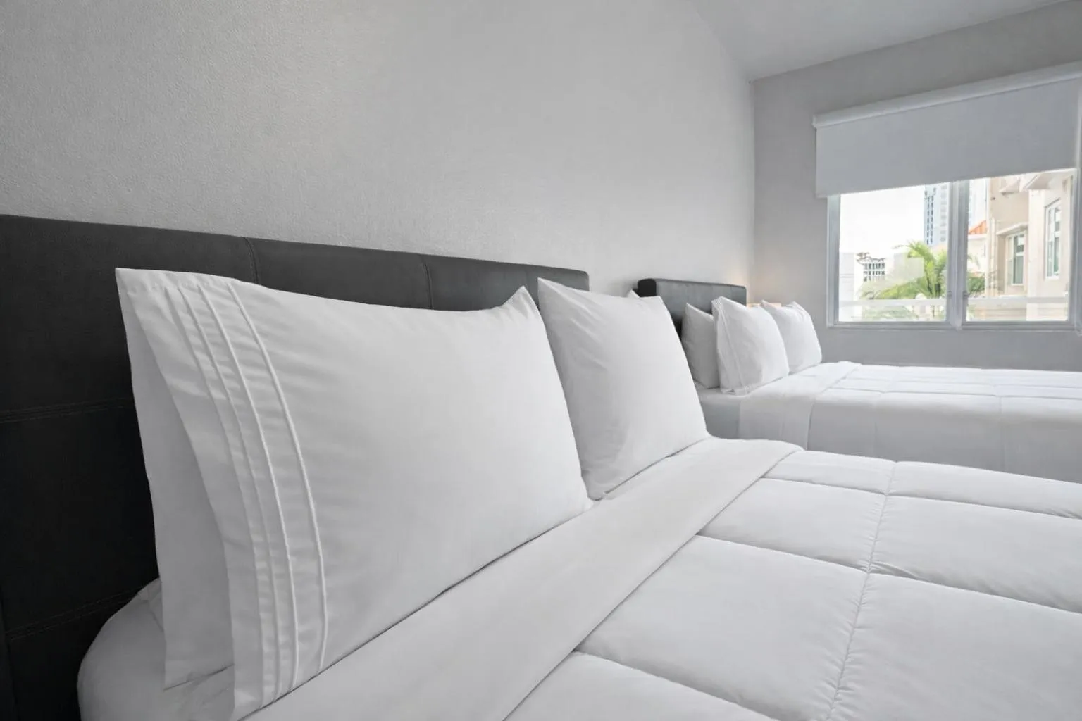 Bed in Coral Princess Hotel