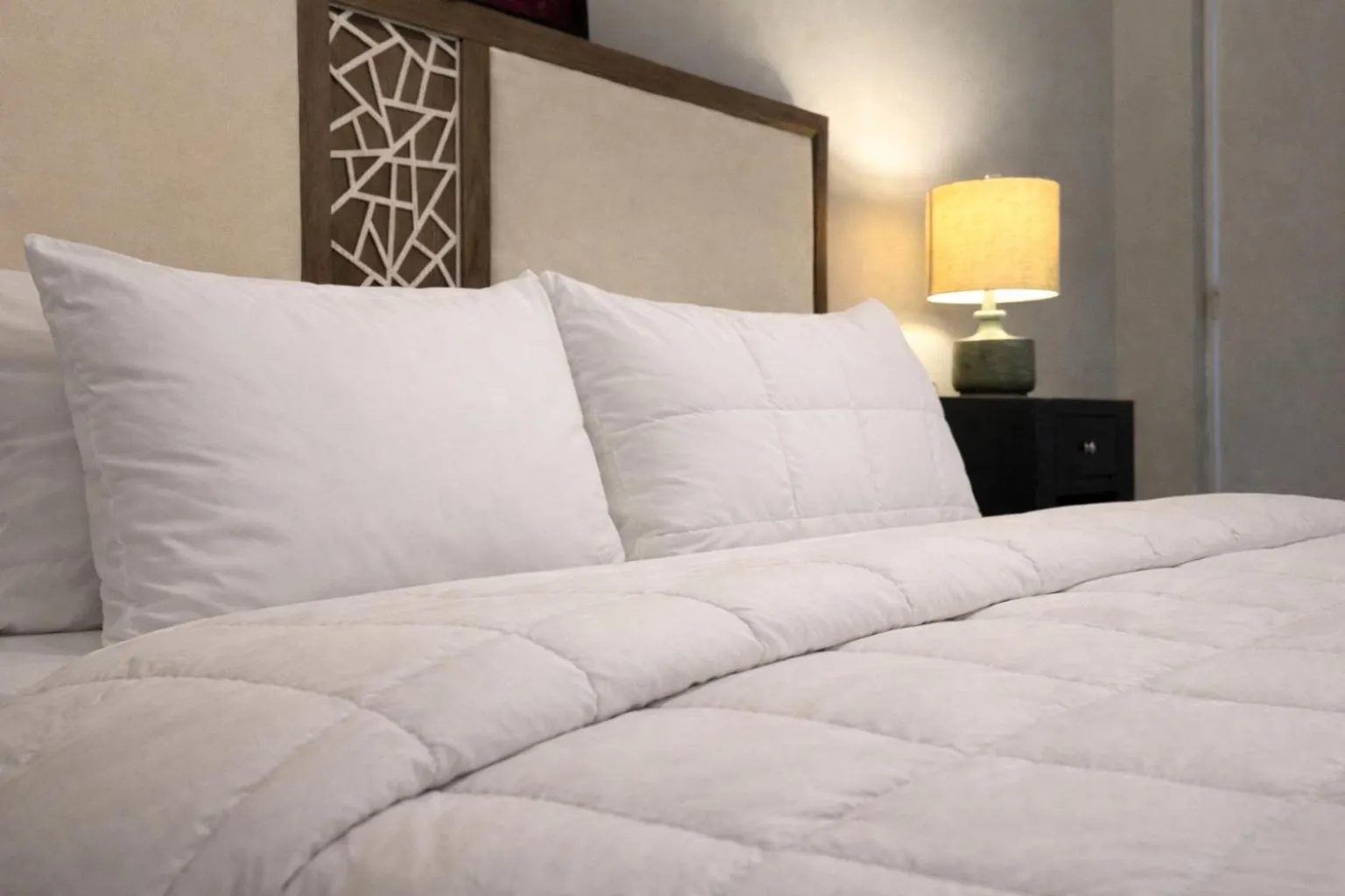 Bed in Coral Princess Hotel