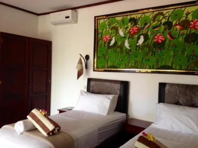 Photo of the whole room, Bed in Kebun Rohani Cottages