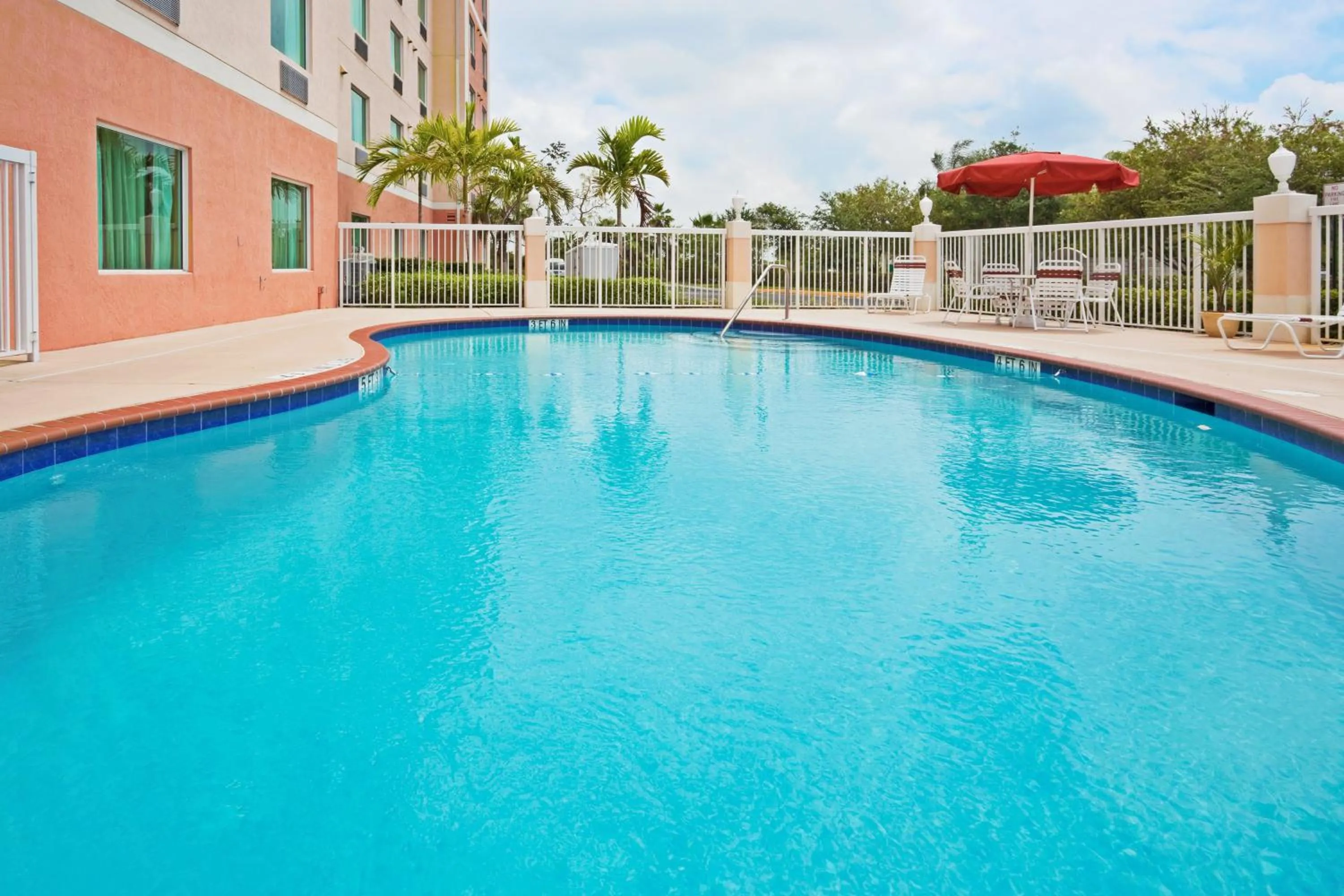 Swimming pool in Holiday Inn Express & Suites Pembroke Pines-Sheridan St by IHG