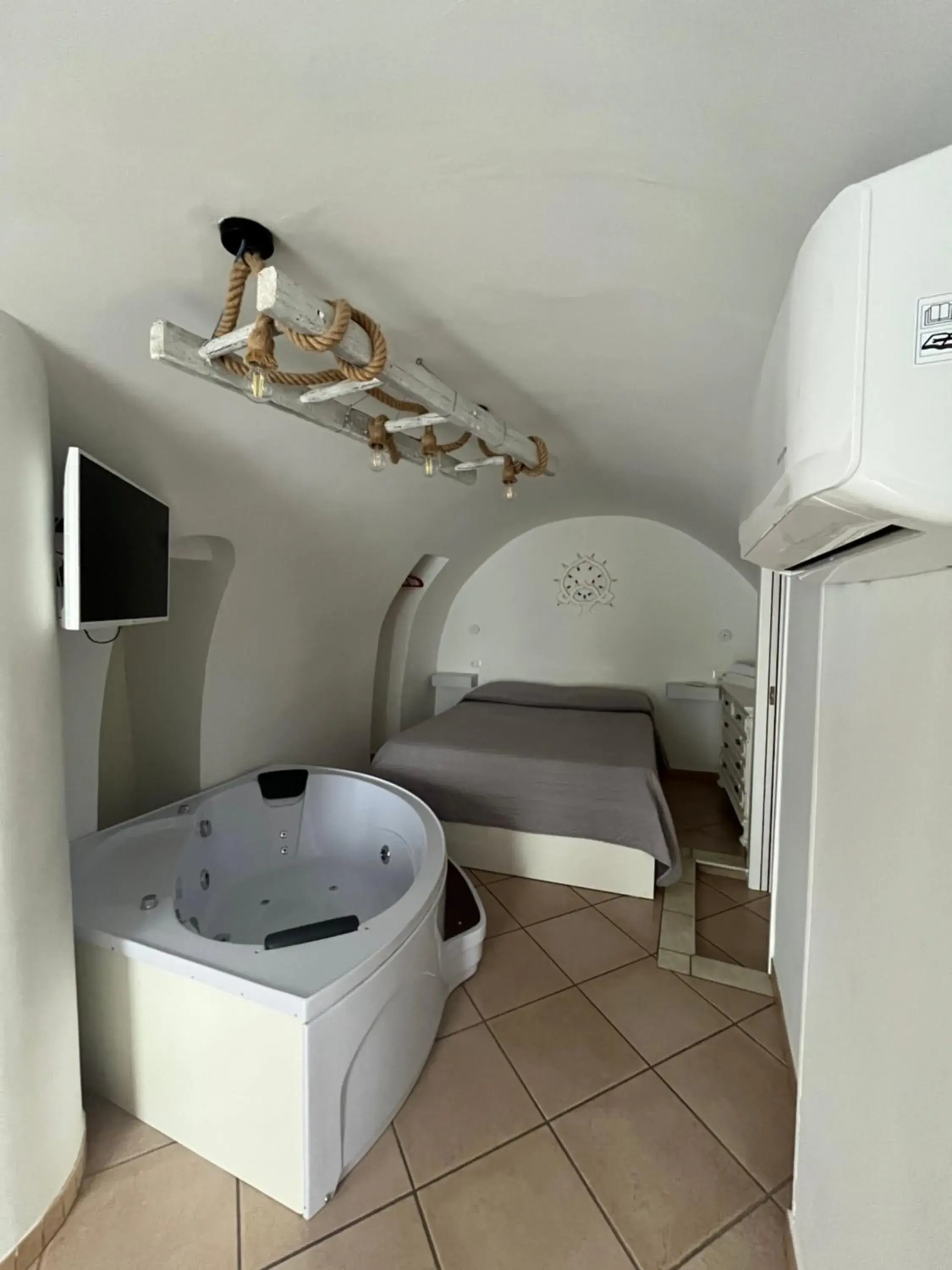 TV and multimedia, Bed in Ostuni 21mq Homes TV and multimedia, Bed in Ostuni 21mq Homes