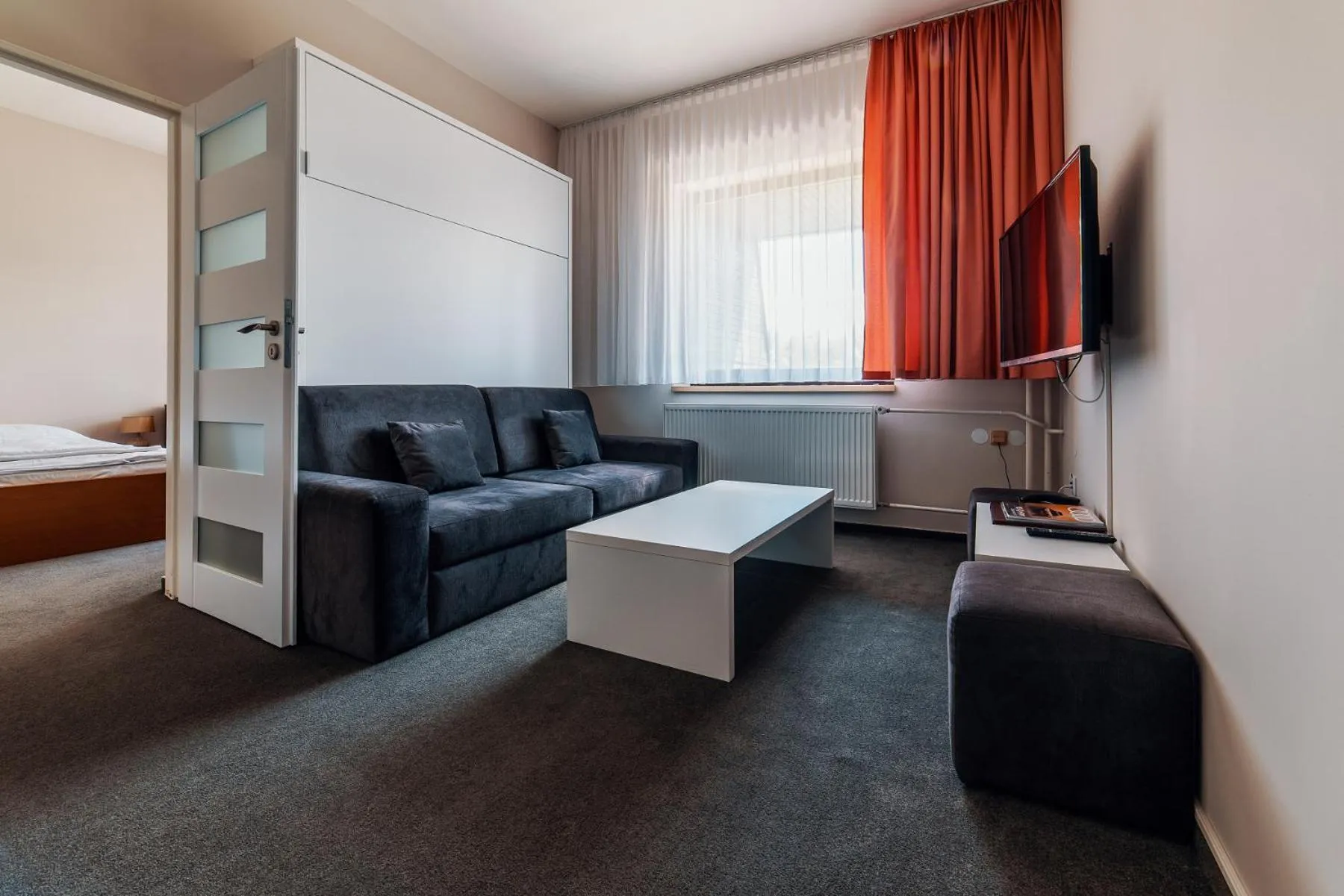 Living room, Bed in Hotel Stupka