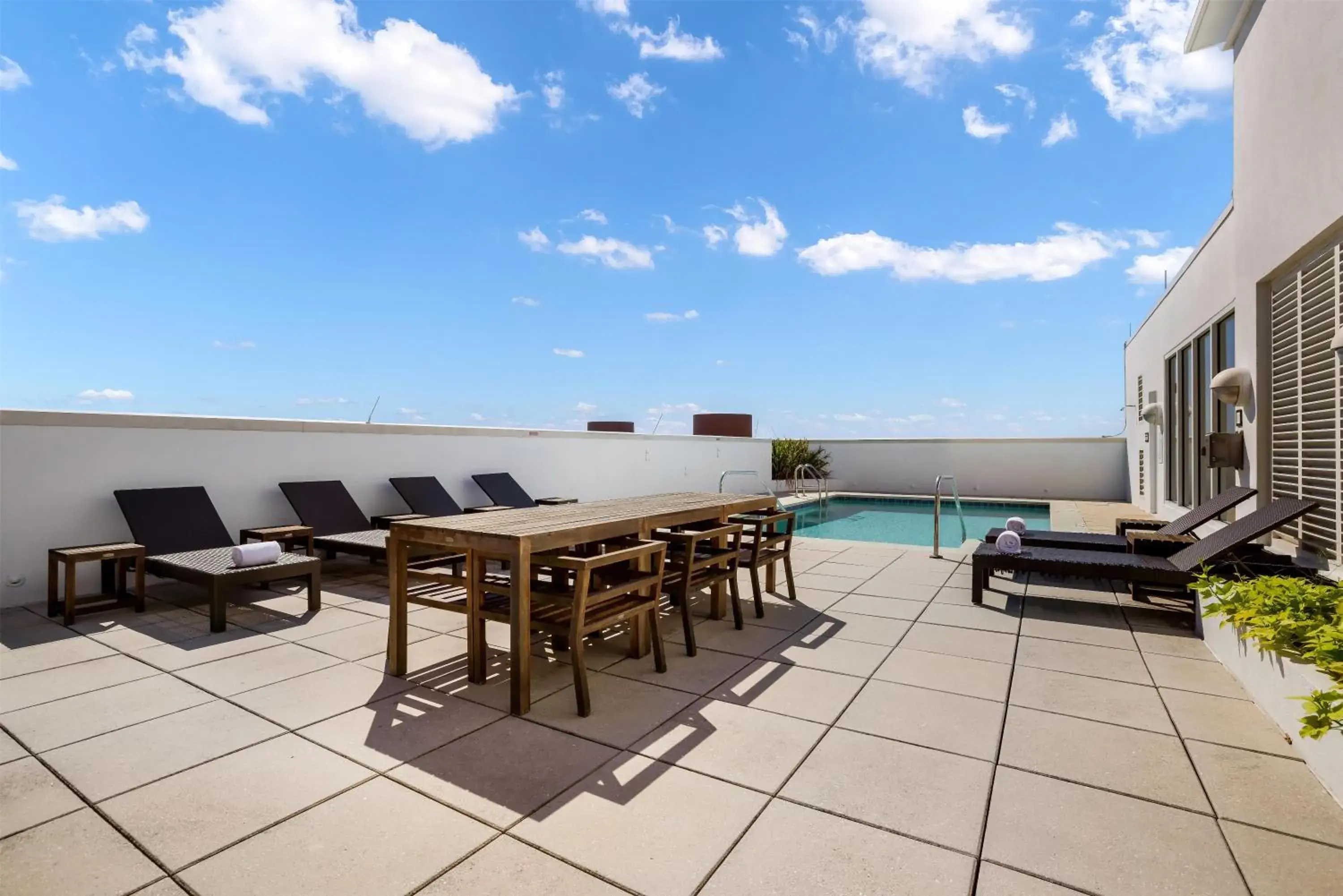 Pool view in The Banyan Hotel Fort Myers, Tapestry Collection by Hilton Pool view in The Banyan Hotel Fort Myers, Tapestry Collection by Hilton