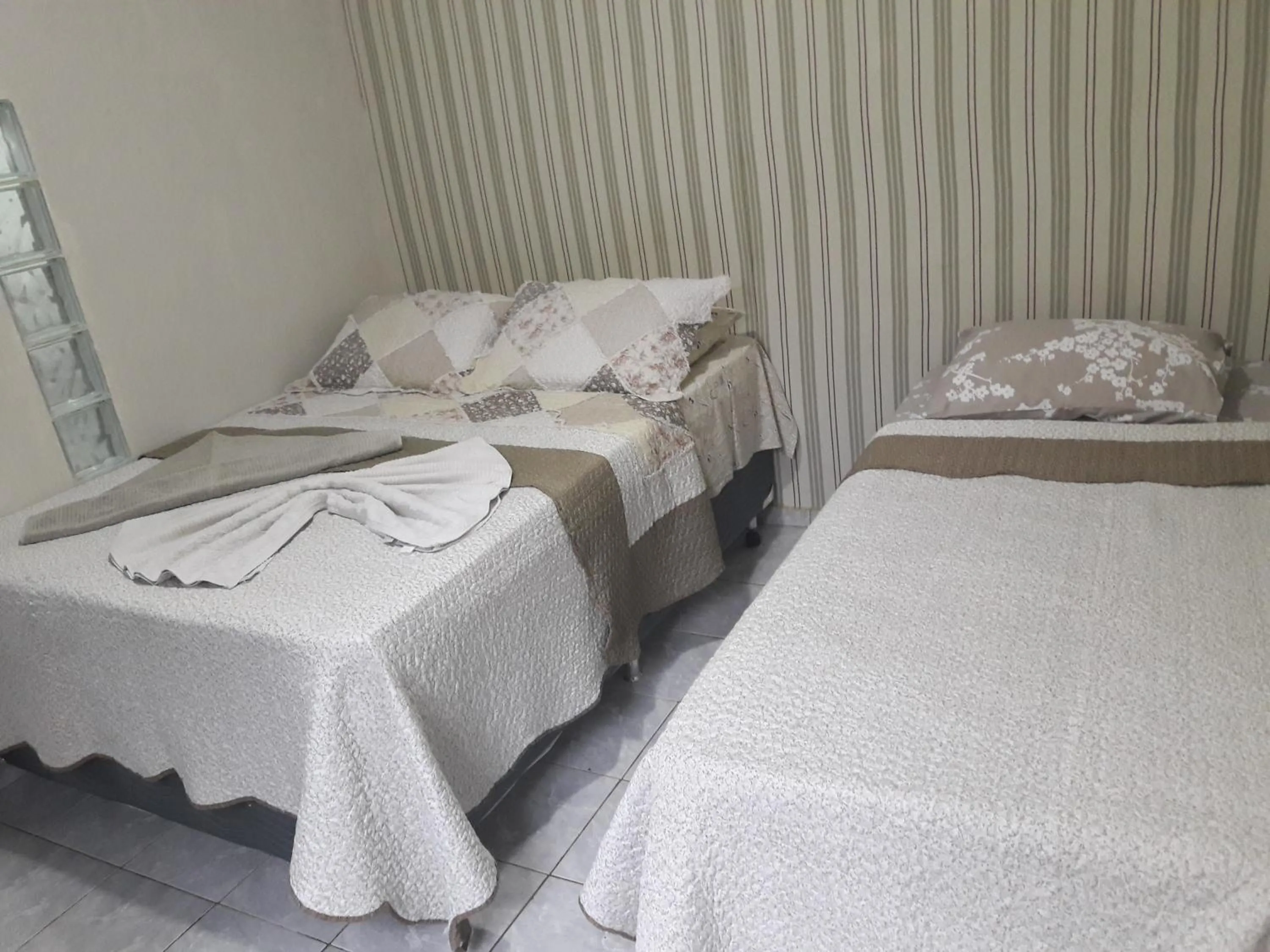 Bed in Pousada Martins e Cia