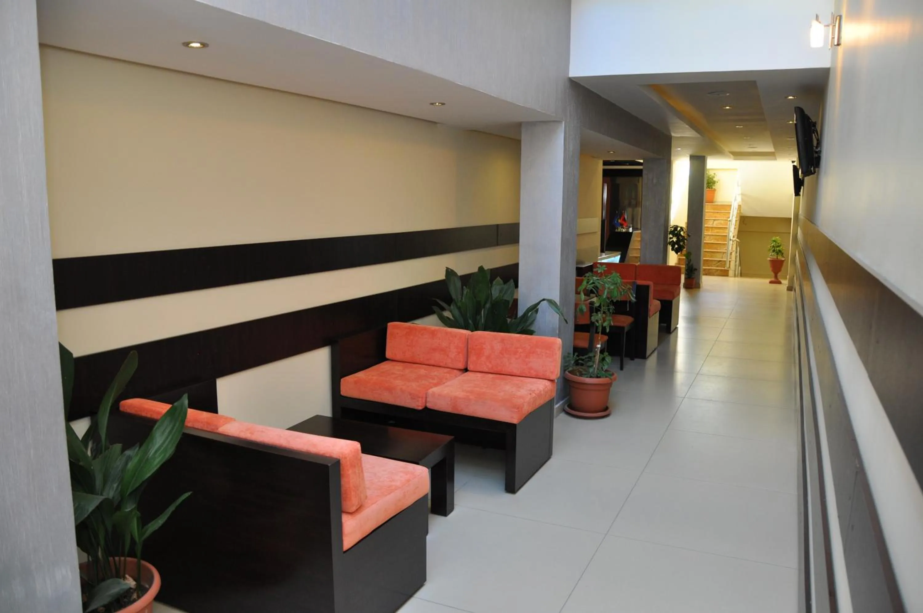 Communal lounge/ TV room in Sunrise Hotel Cameria