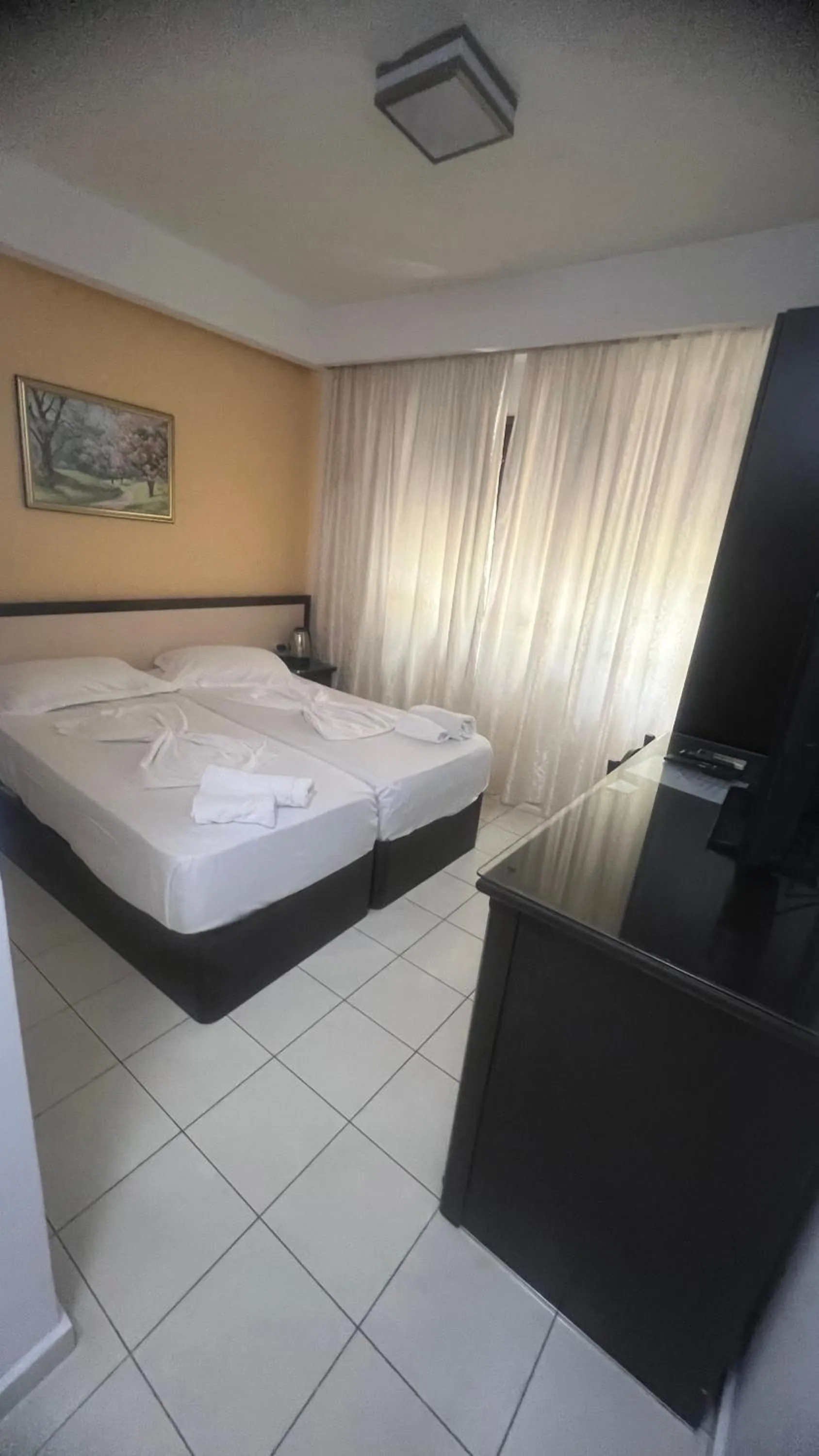 Bed in Sunrise Hotel Cameria