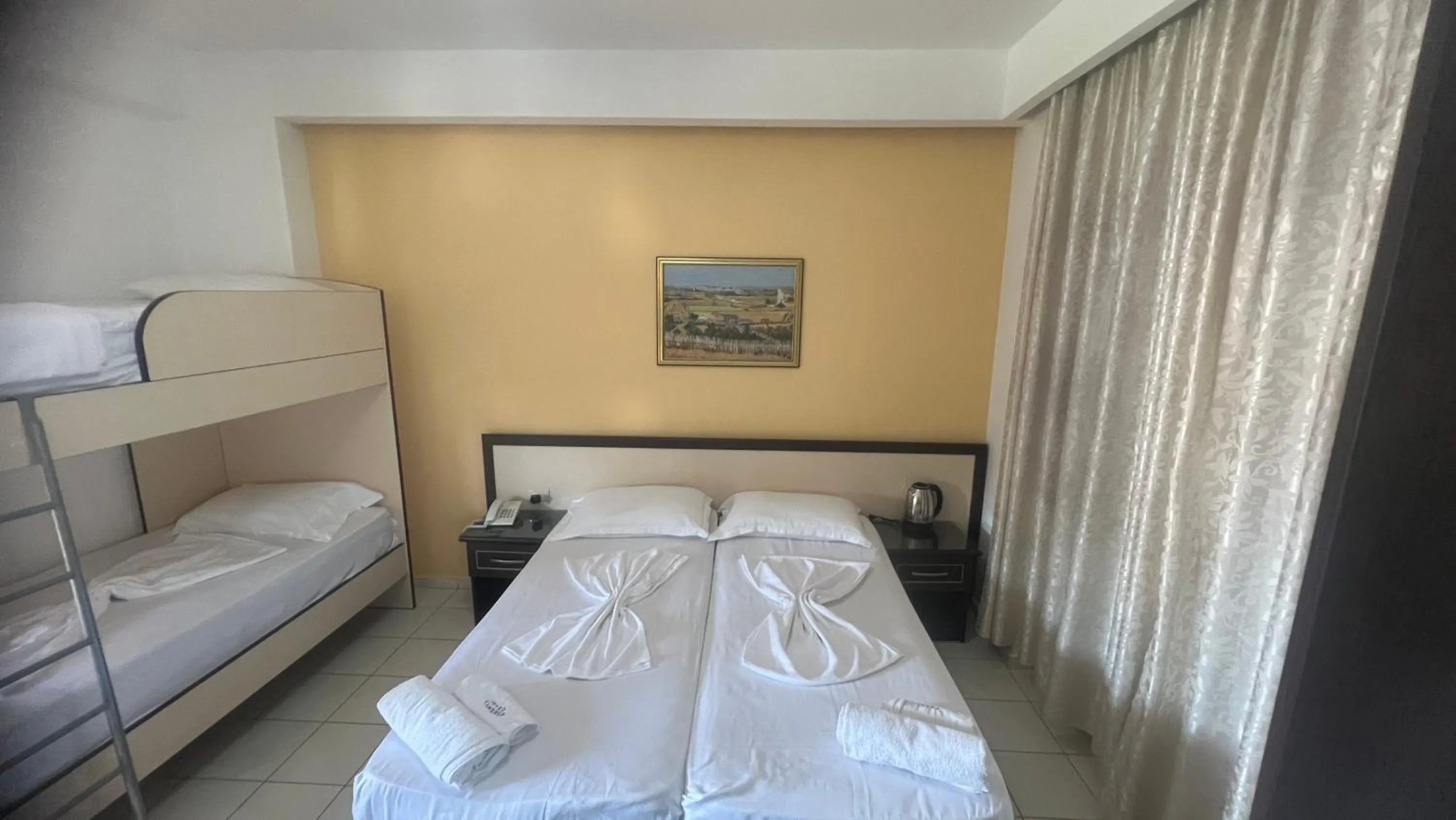 Bed in Sunrise Hotel Cameria