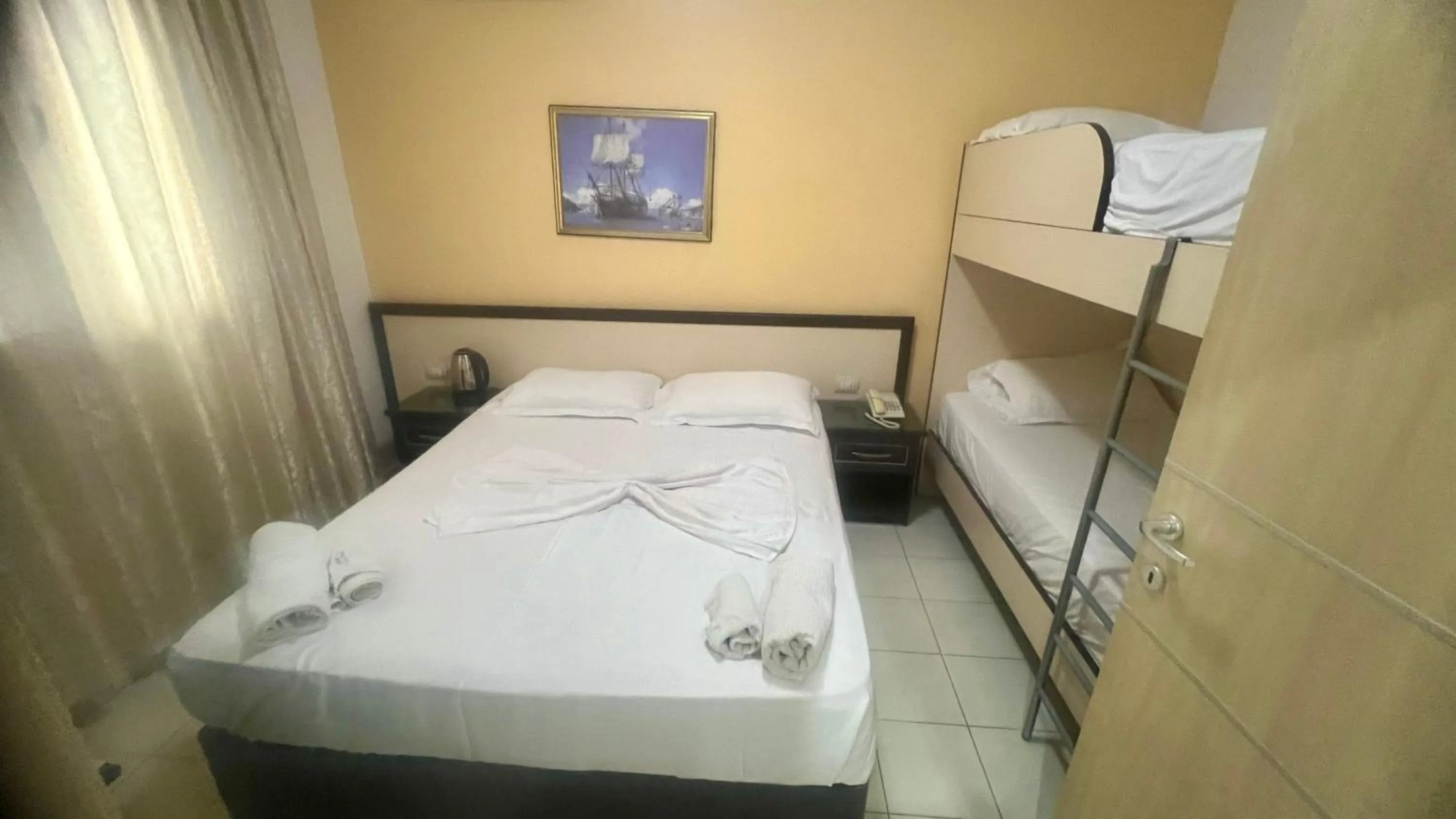 Bed in Sunrise Hotel Cameria