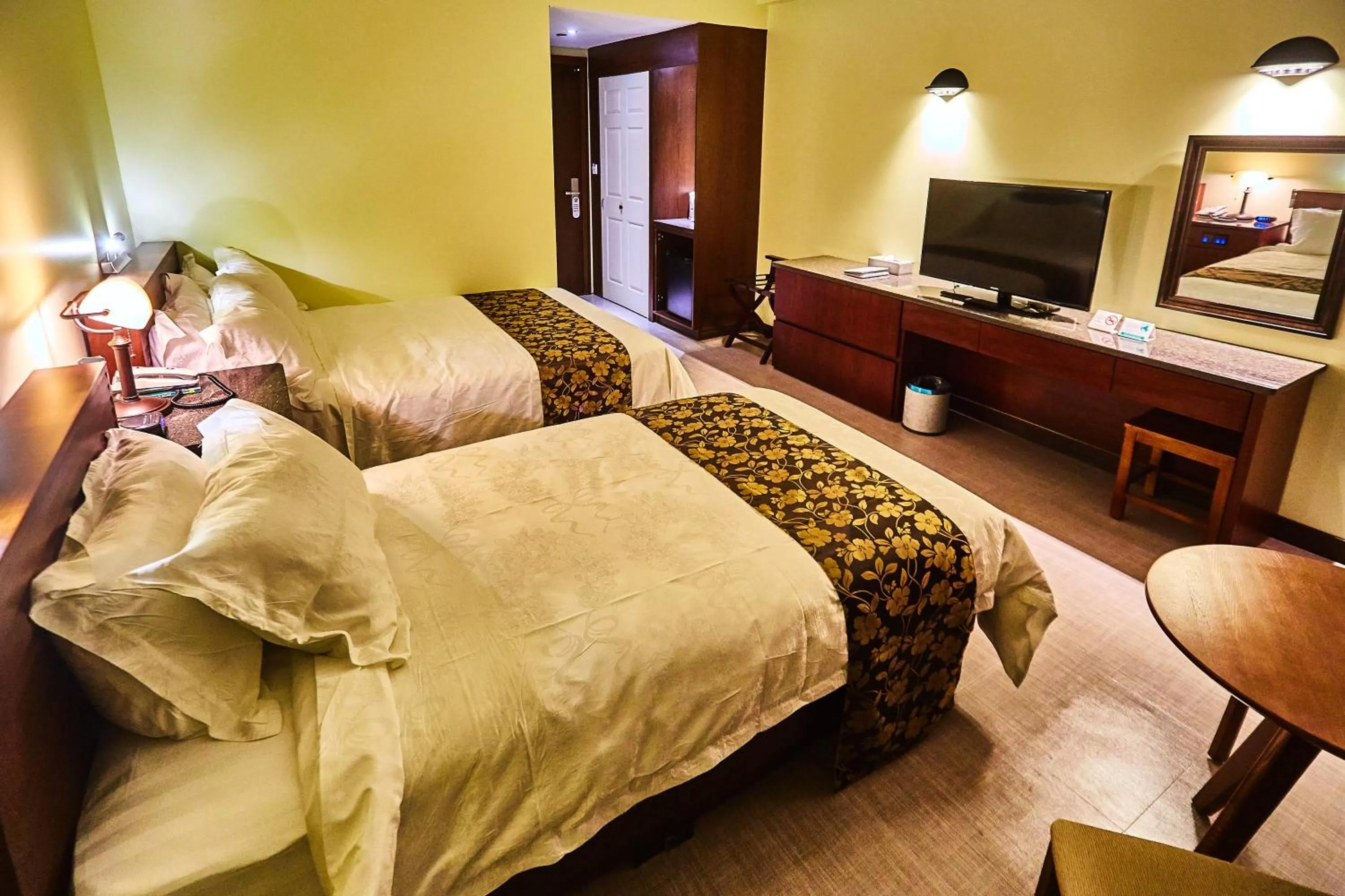 Photo of the whole room, Bed in Serenti Hotel Saipan