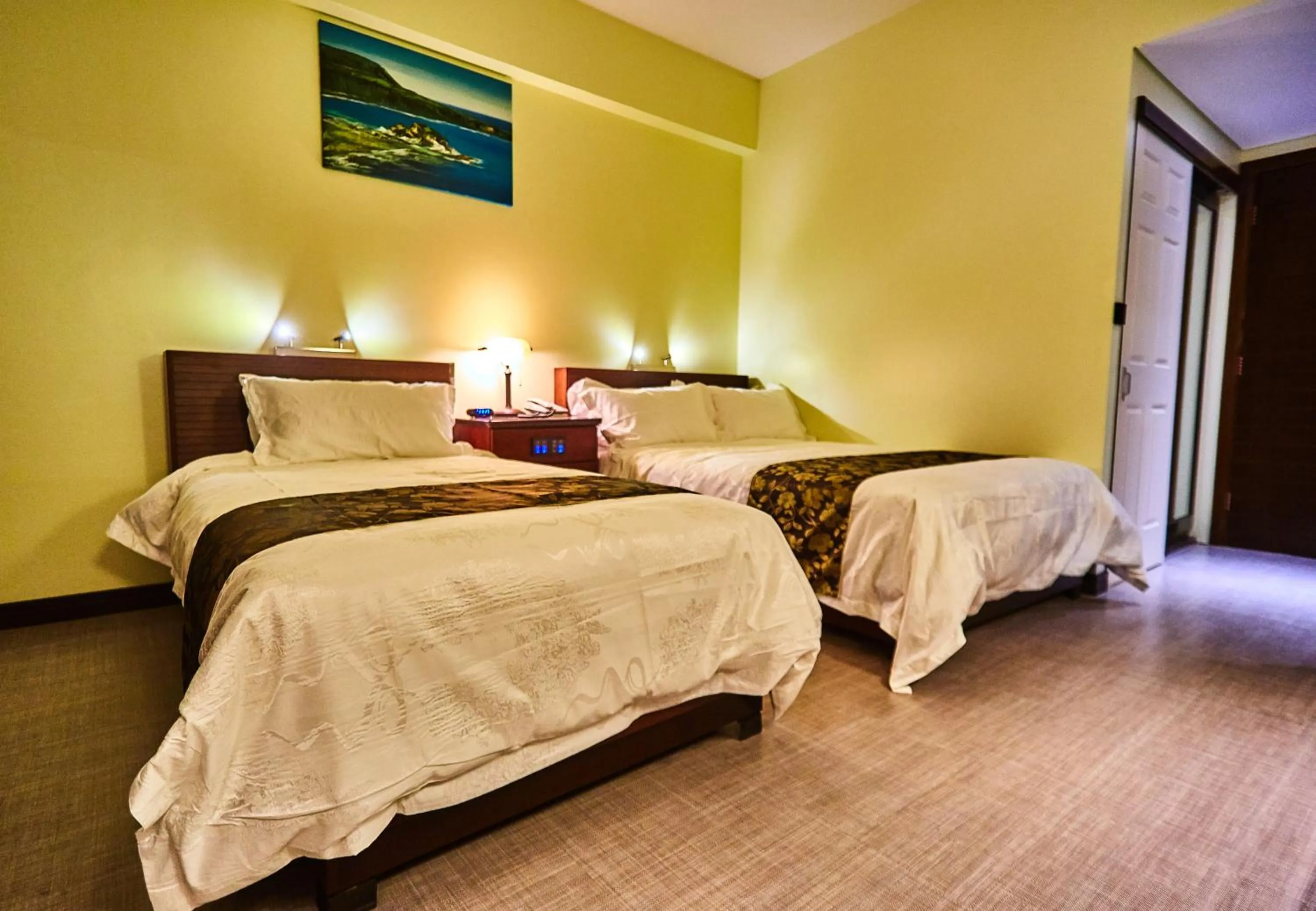 Bed in Serenti Hotel Saipan