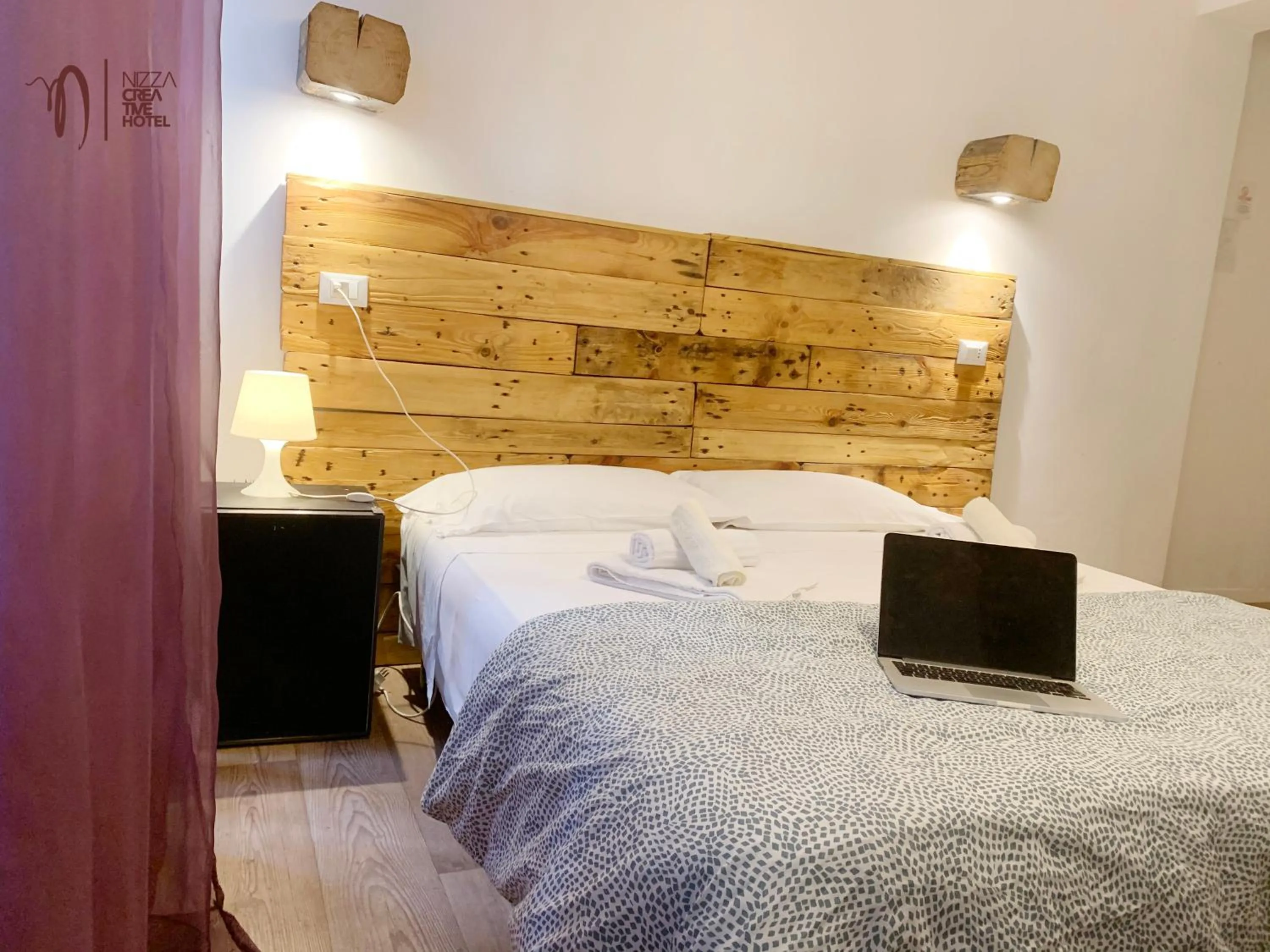 Bed in Hotel Nizza Creative Hotel