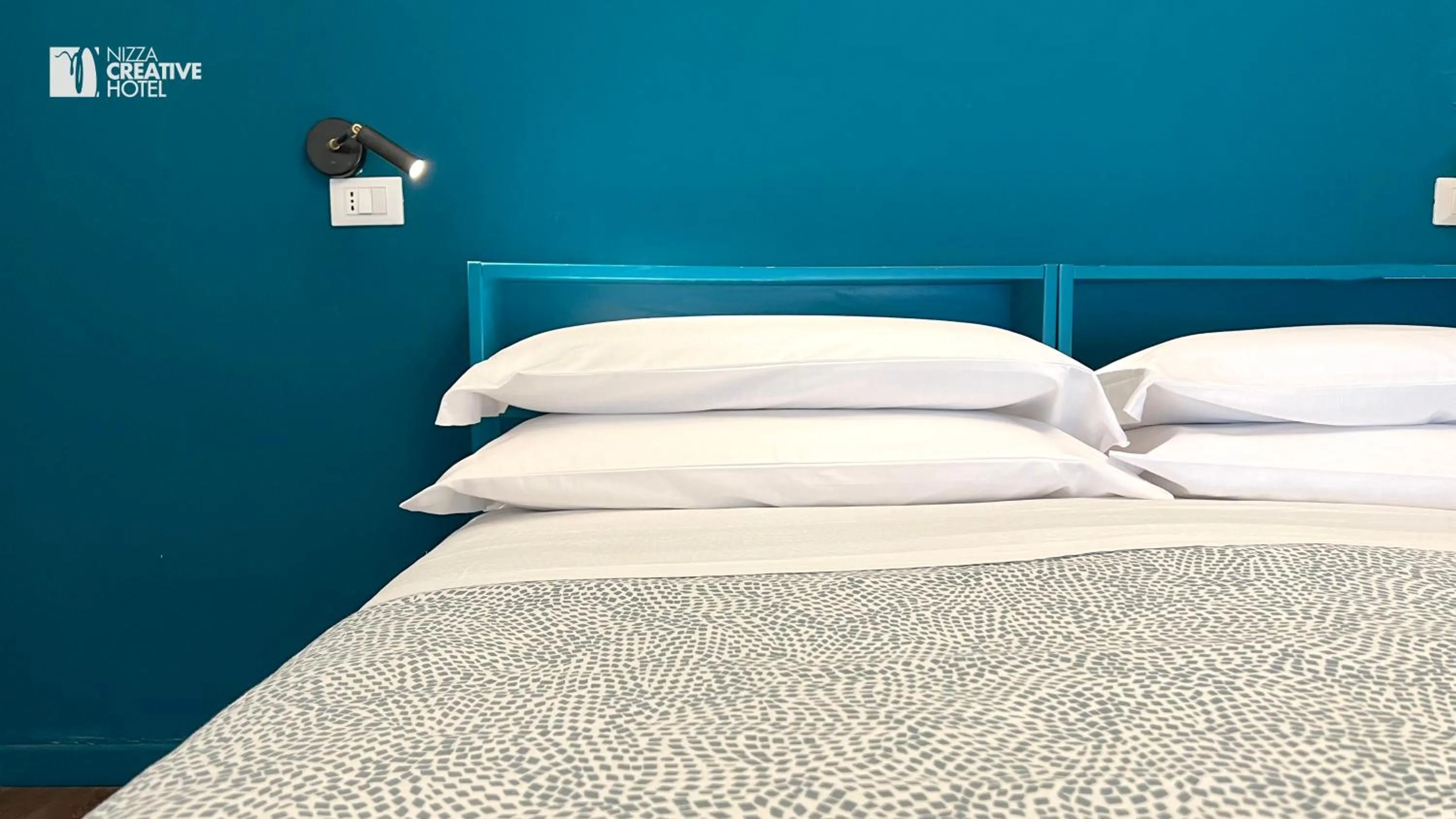 Bed in Hotel Nizza Creative Hotel