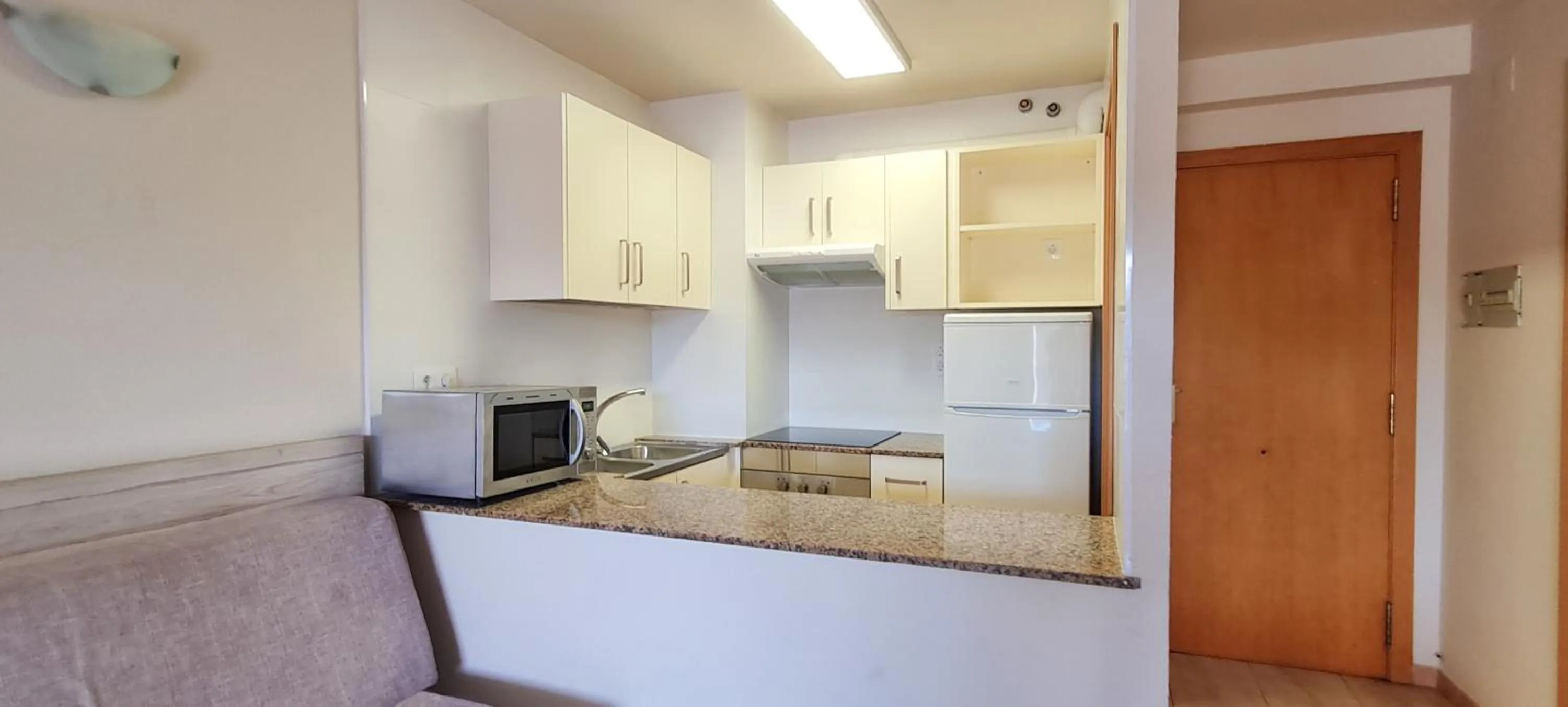 Kitchen or kitchenette in Apartamentos Turísticos Augustus