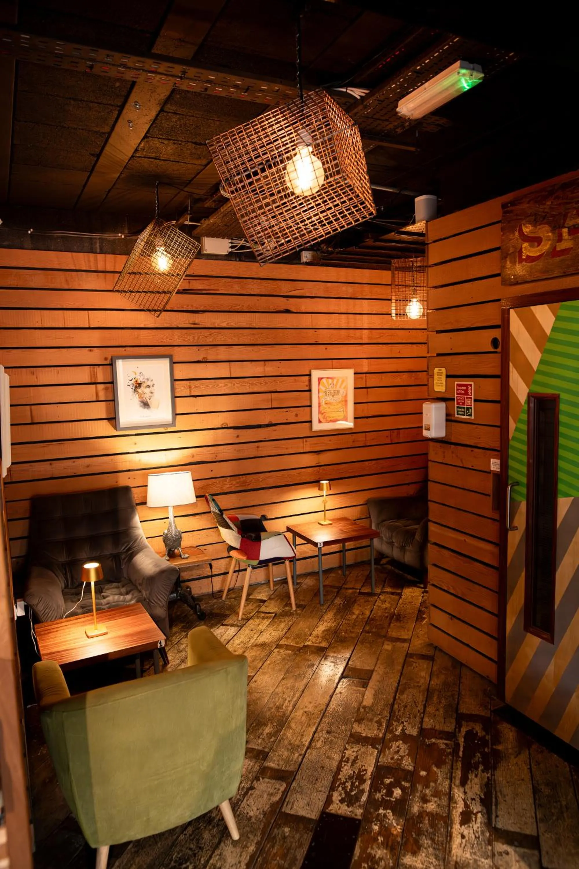 Communal lounge/ TV room in The Nest Boutique Hostel