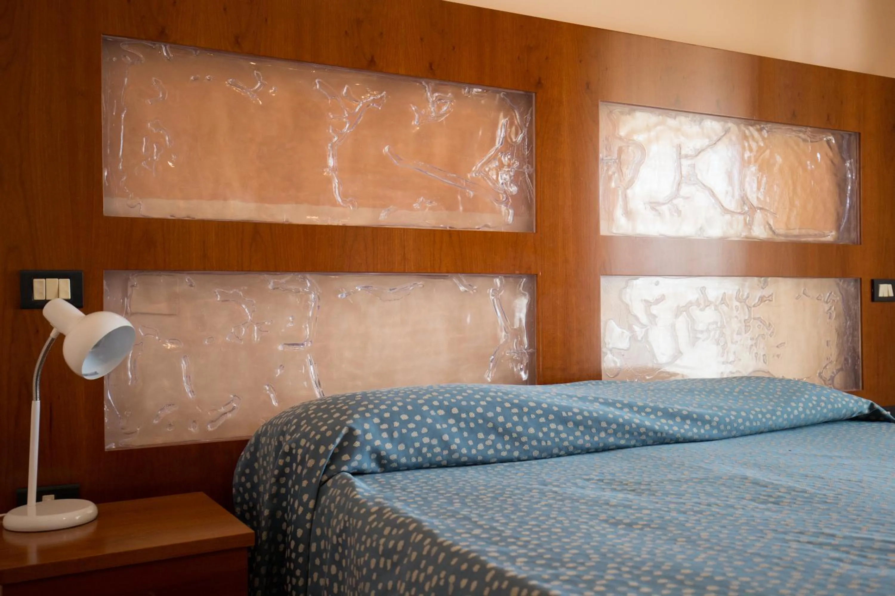 Bed in Hotel L'Aragosta