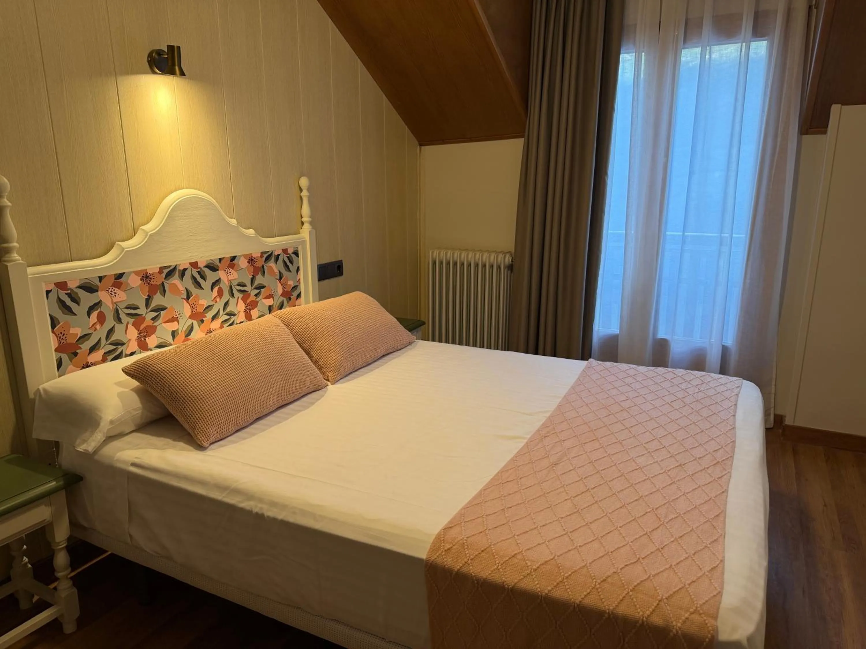 Bed in Edelweiss Hotel