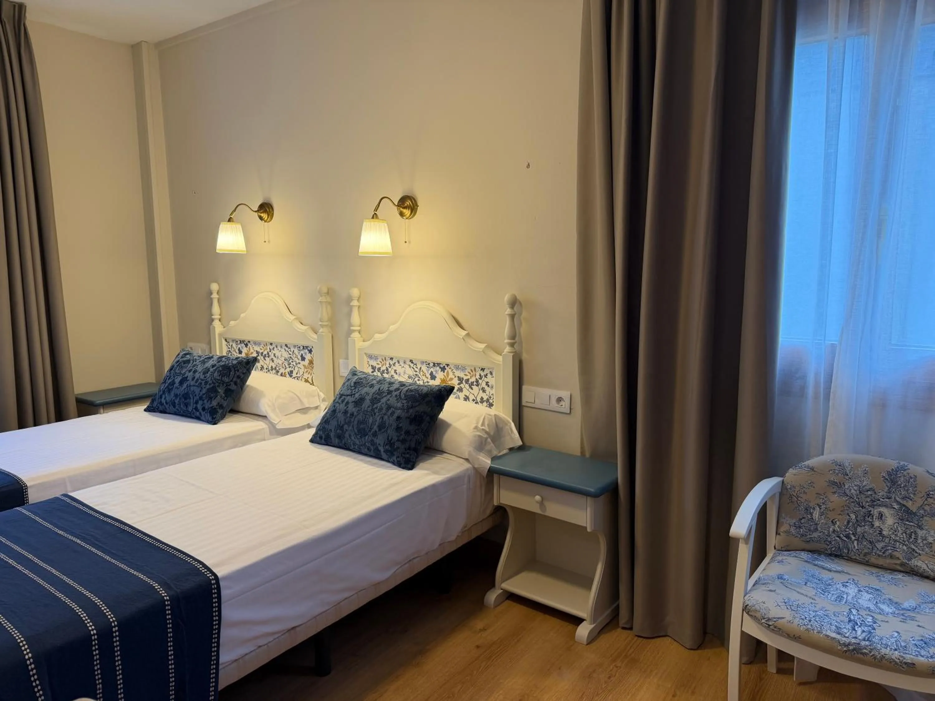 Bed in Edelweiss Hotel