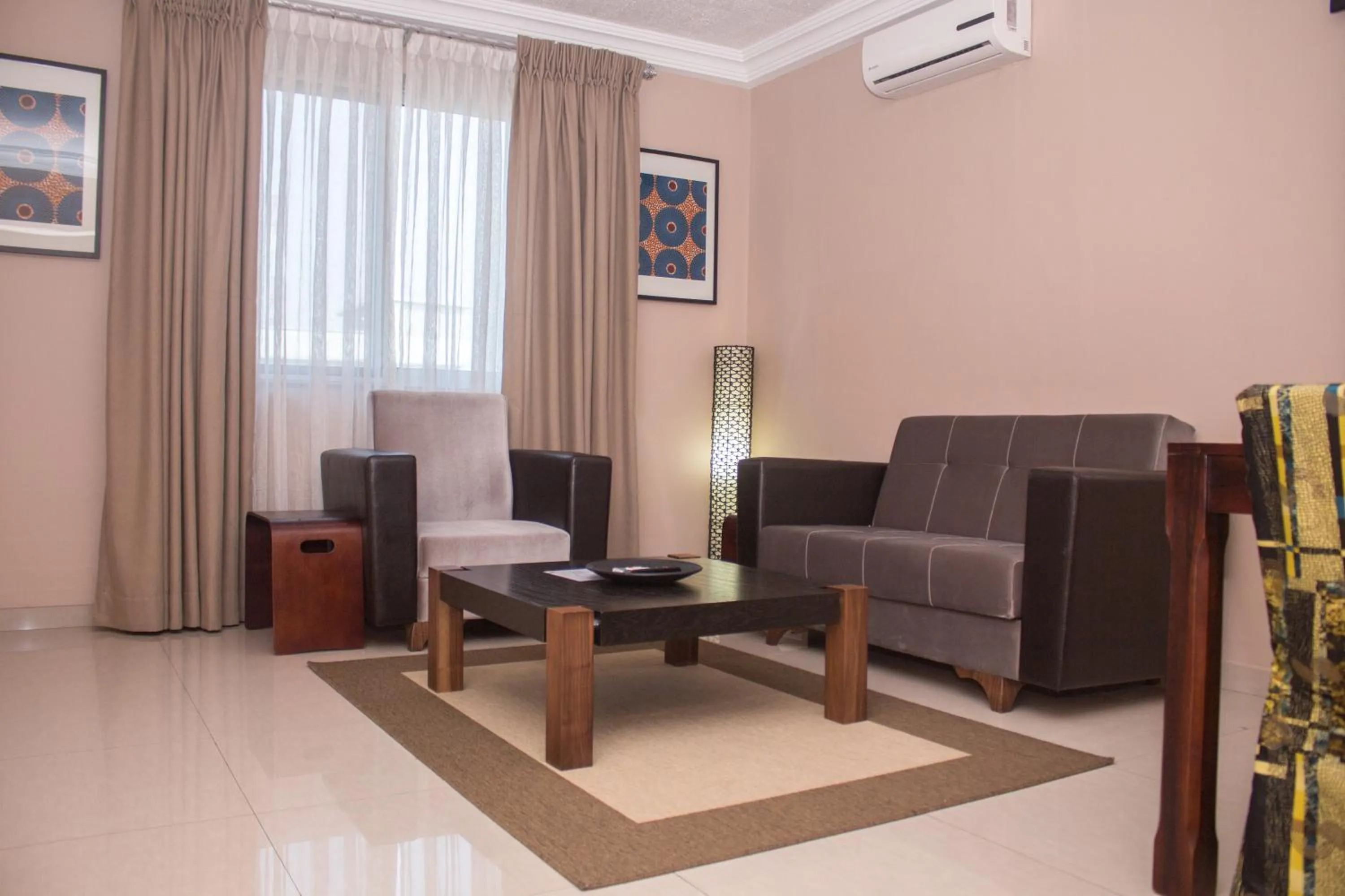 Communal lounge/ TV room in Manjaro Suites