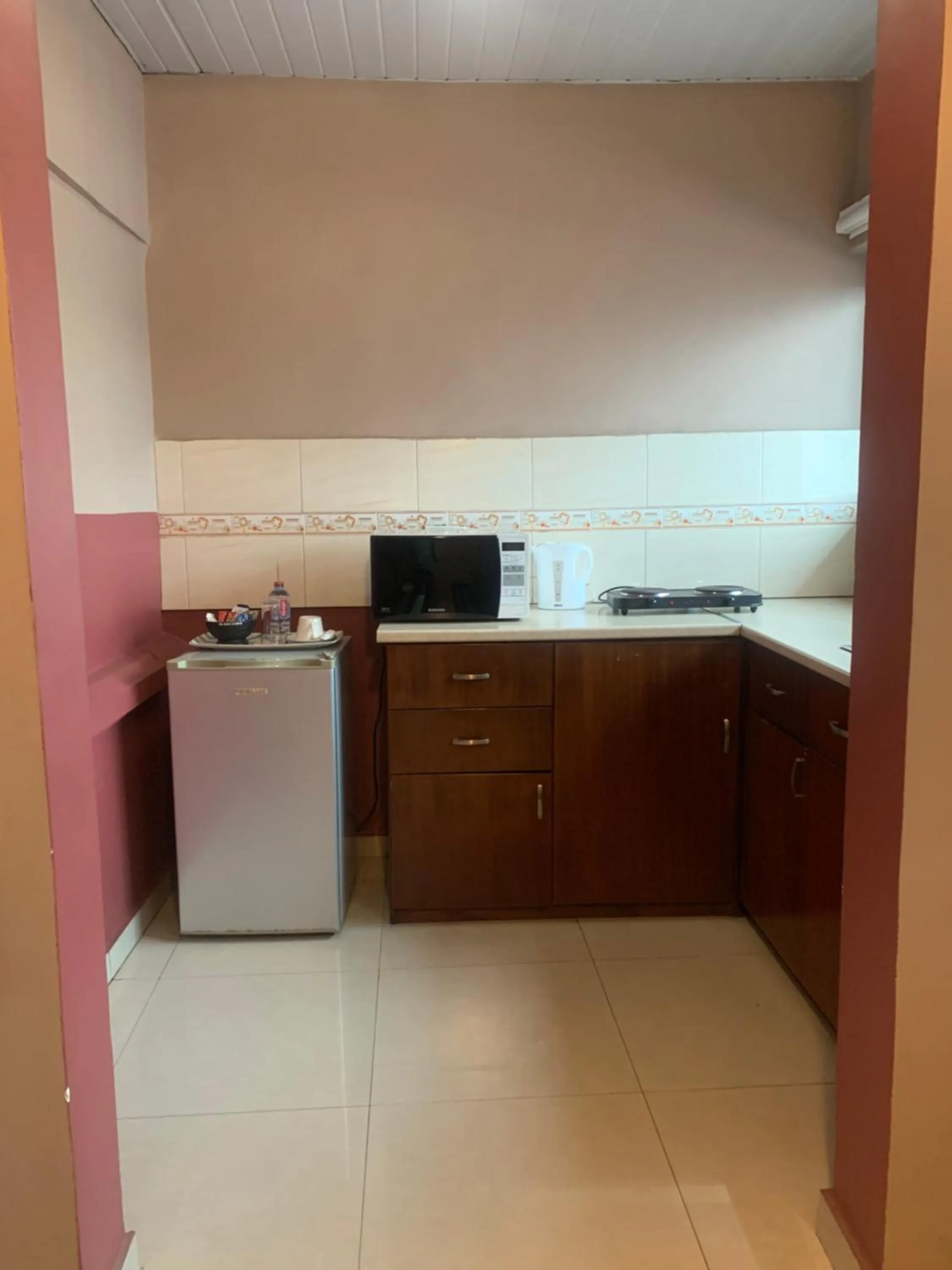 Kitchen or kitchenette in Manjaro Suites