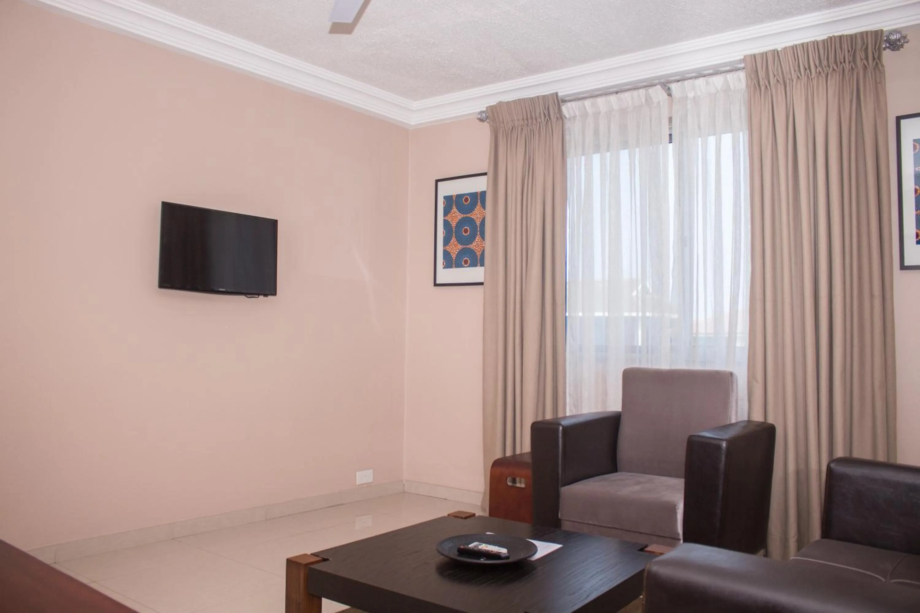 Communal lounge/ TV room in Manjaro Suites
