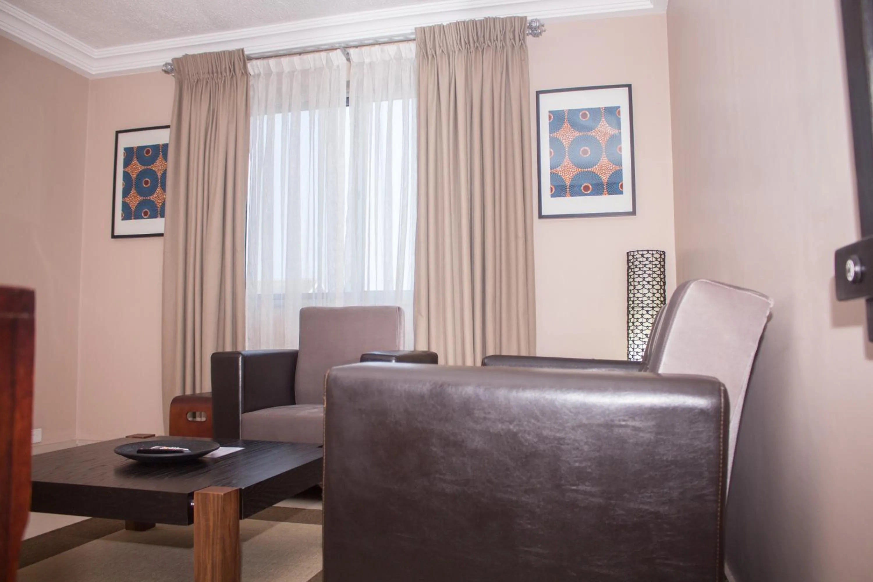 Communal lounge/ TV room in Manjaro Suites