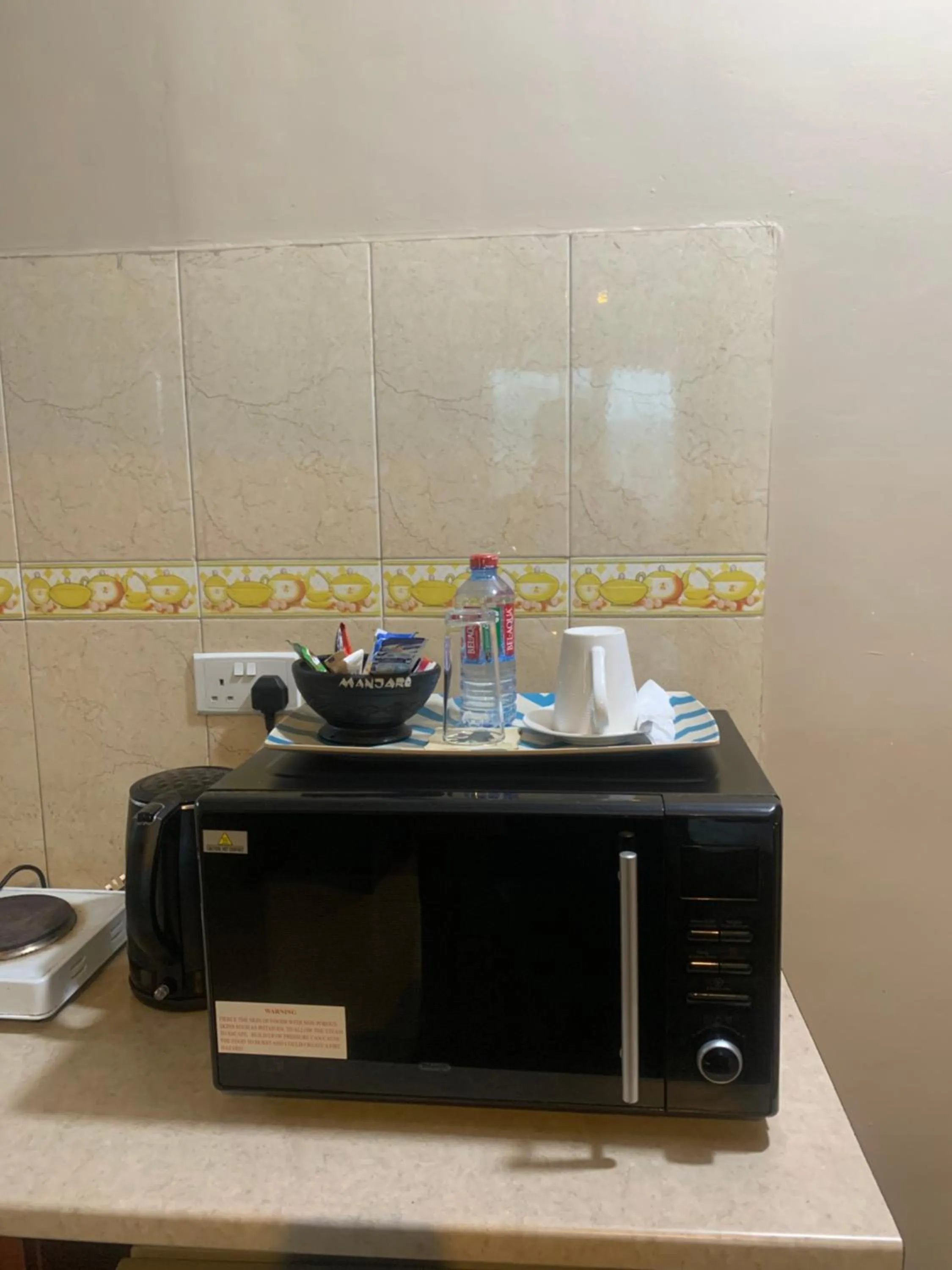 Kitchen or kitchenette in Manjaro Suites