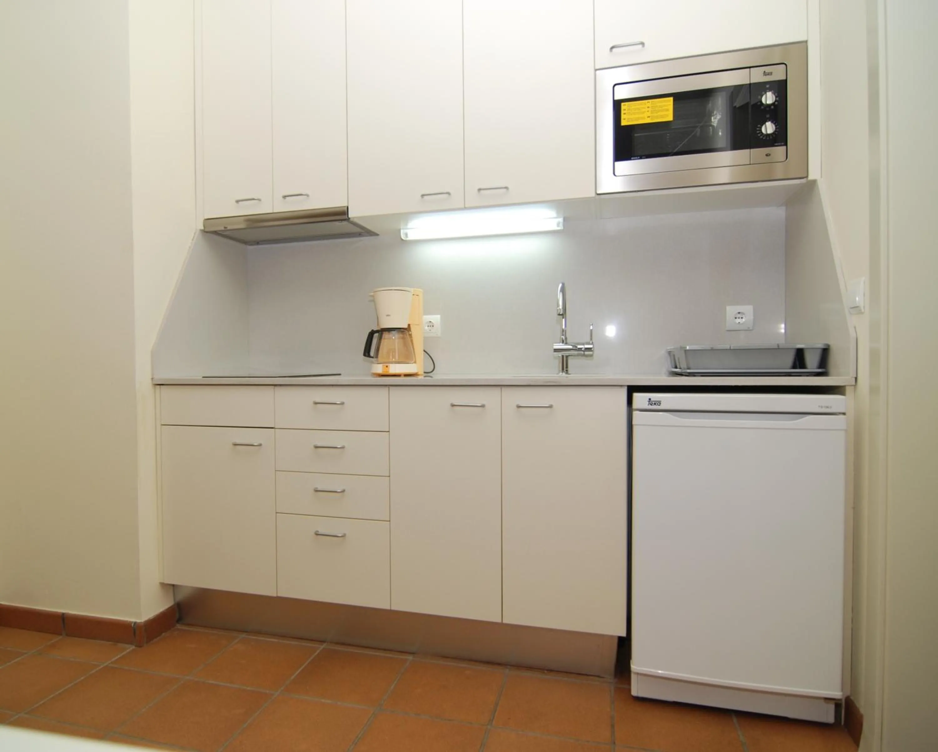 Kitchen or kitchenette in Aparthotel Ciutat de Palol
