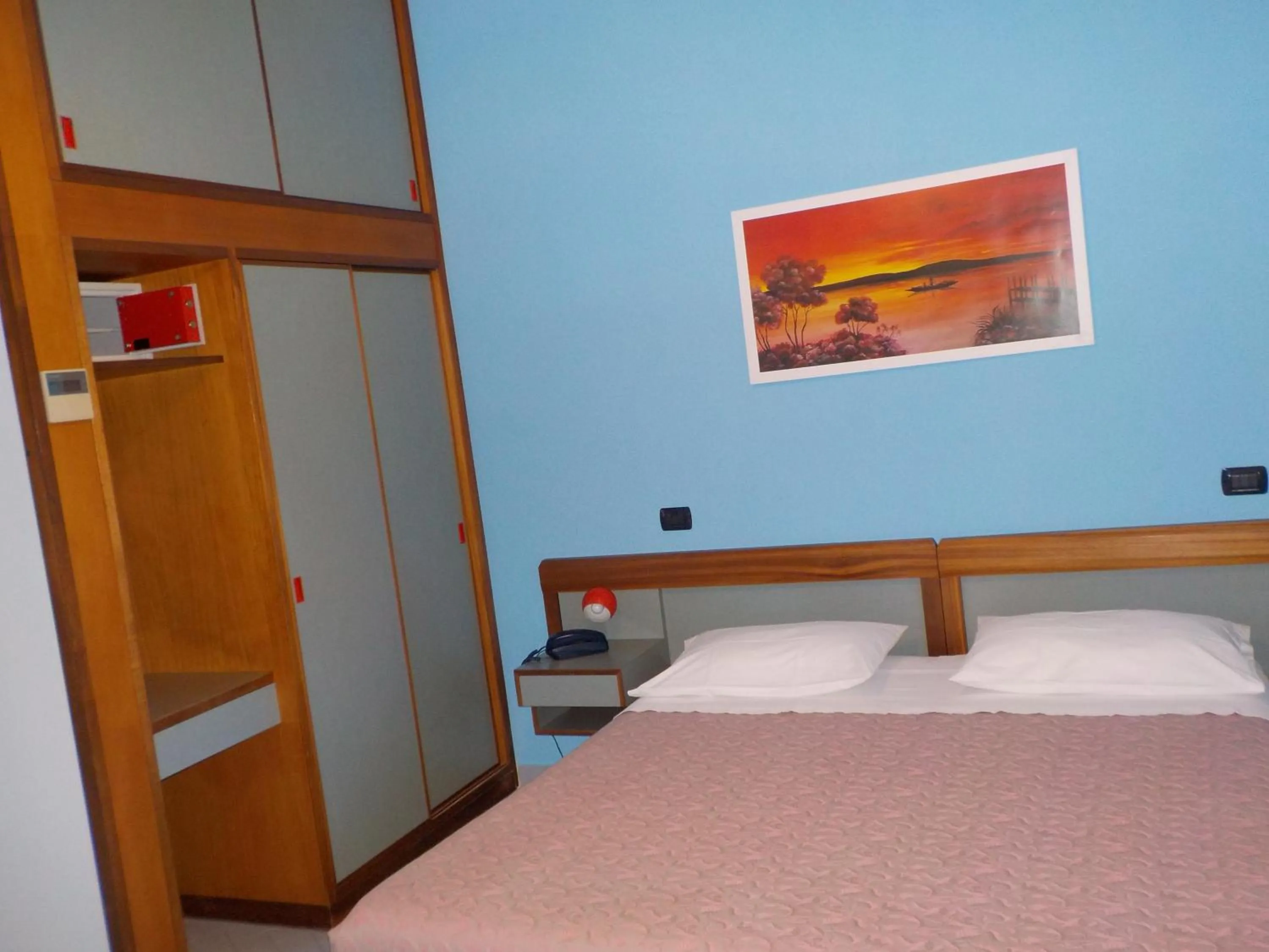 Bed in Hotel Le Pleiadi