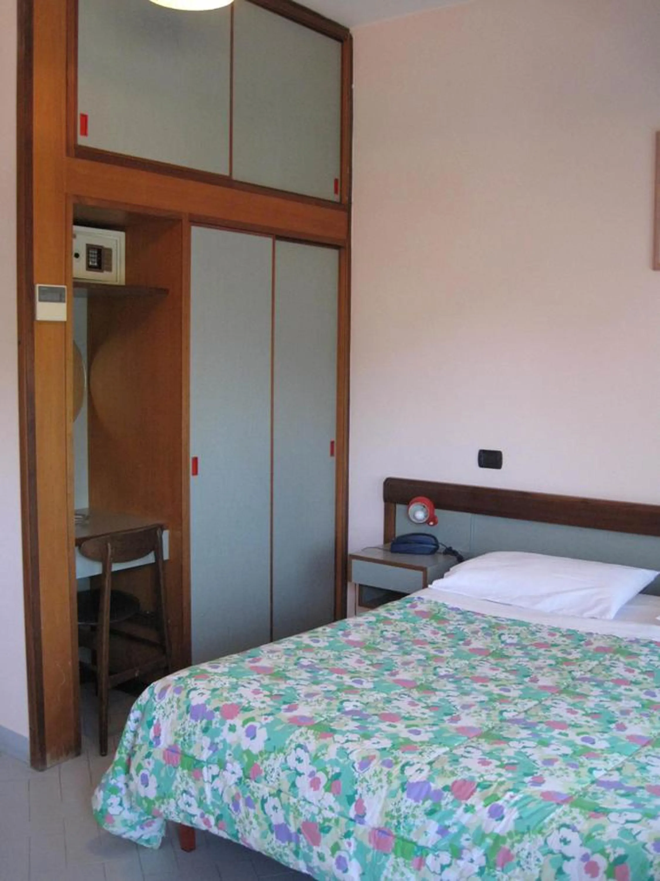 Bed in Hotel Le Pleiadi