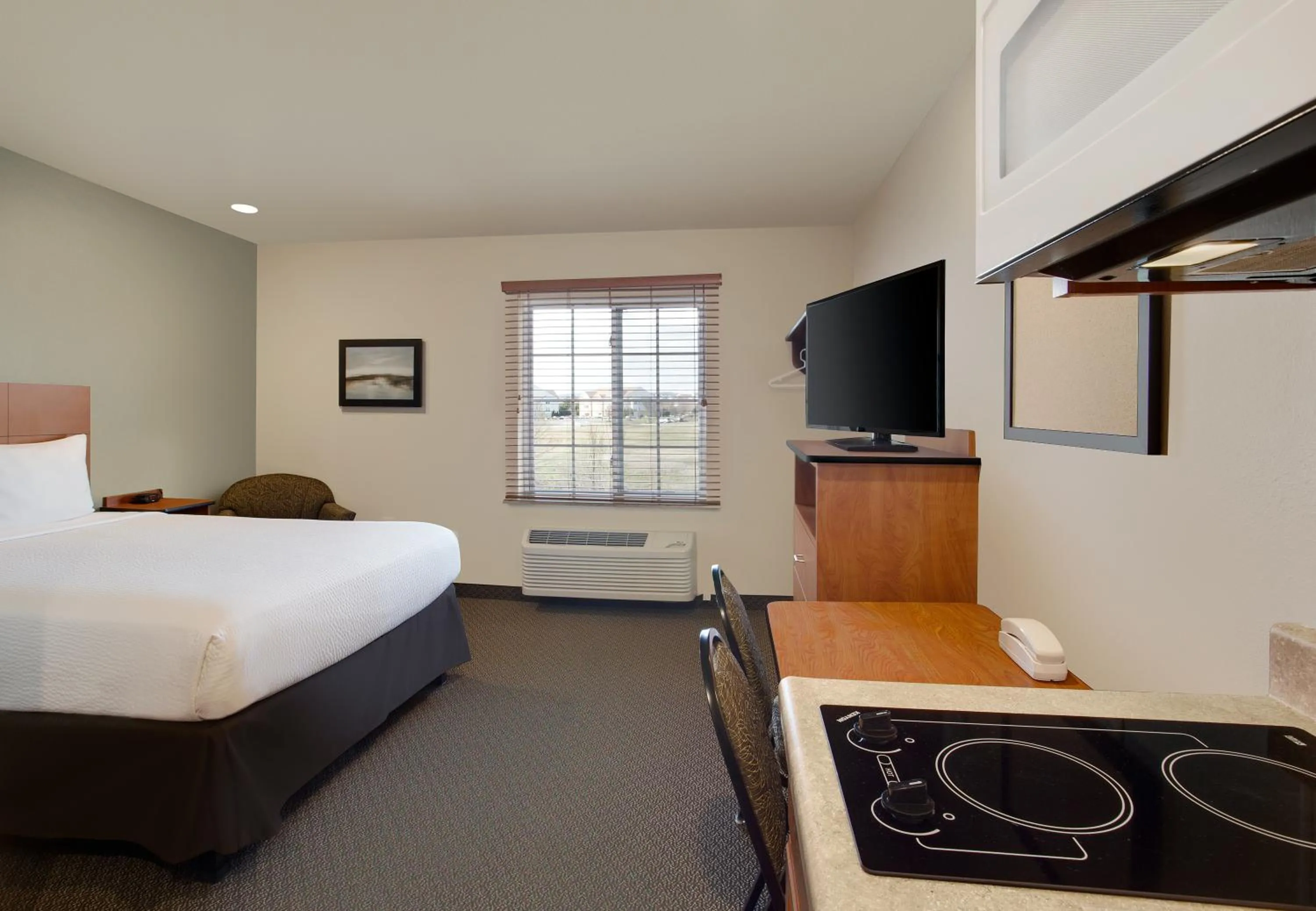 Photo of the whole room, Bed in WoodSpring Suites Frederick I-70