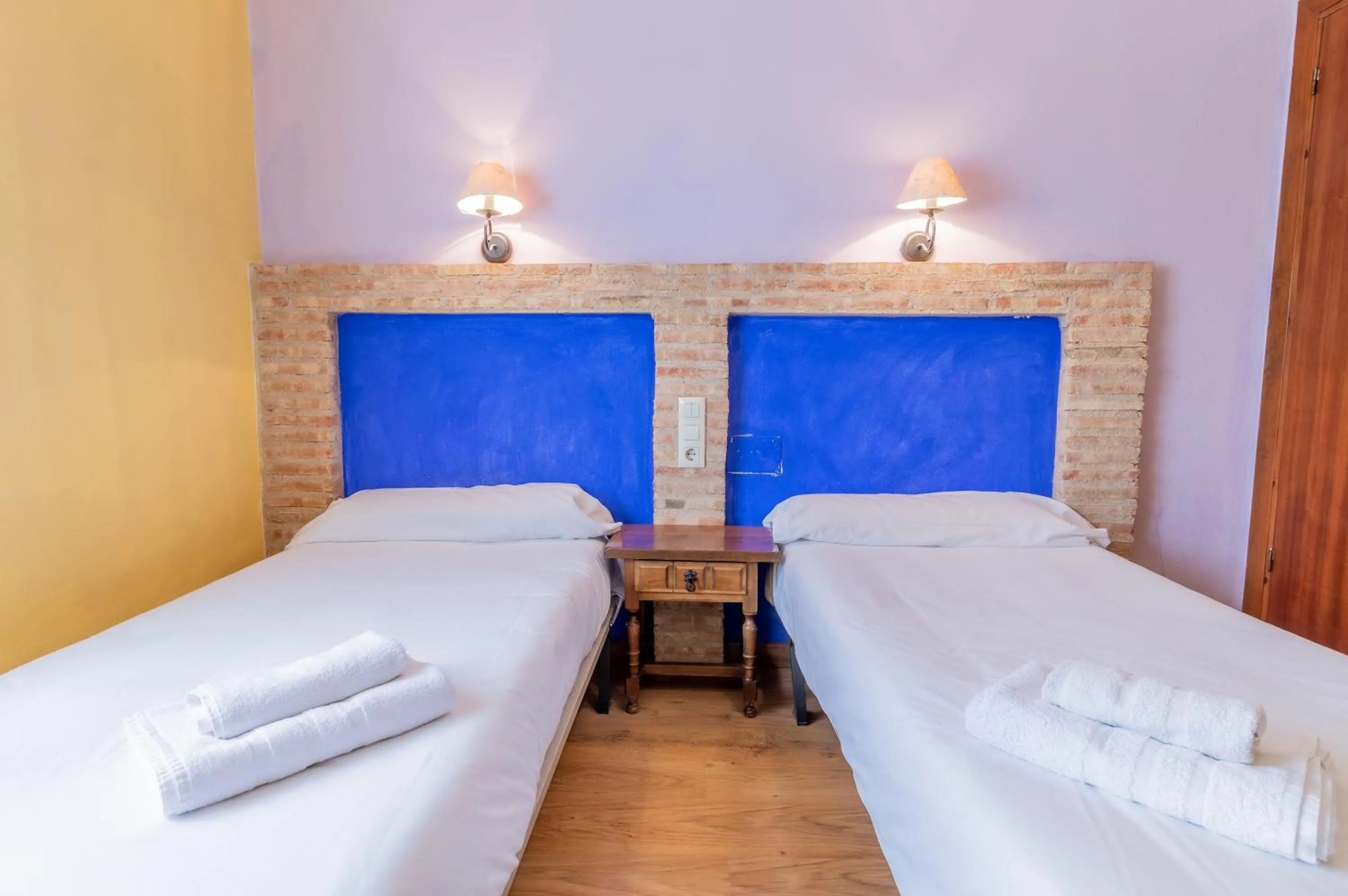 Bed in Hosteria Tierrallana by Juypehotel