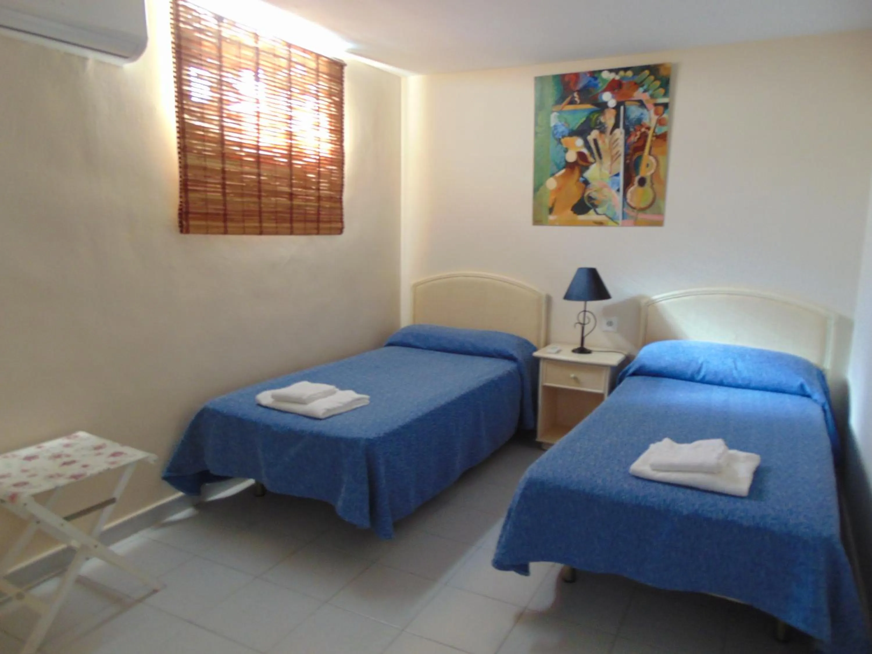 Bedroom, Bed in Apartamentos Larga 70