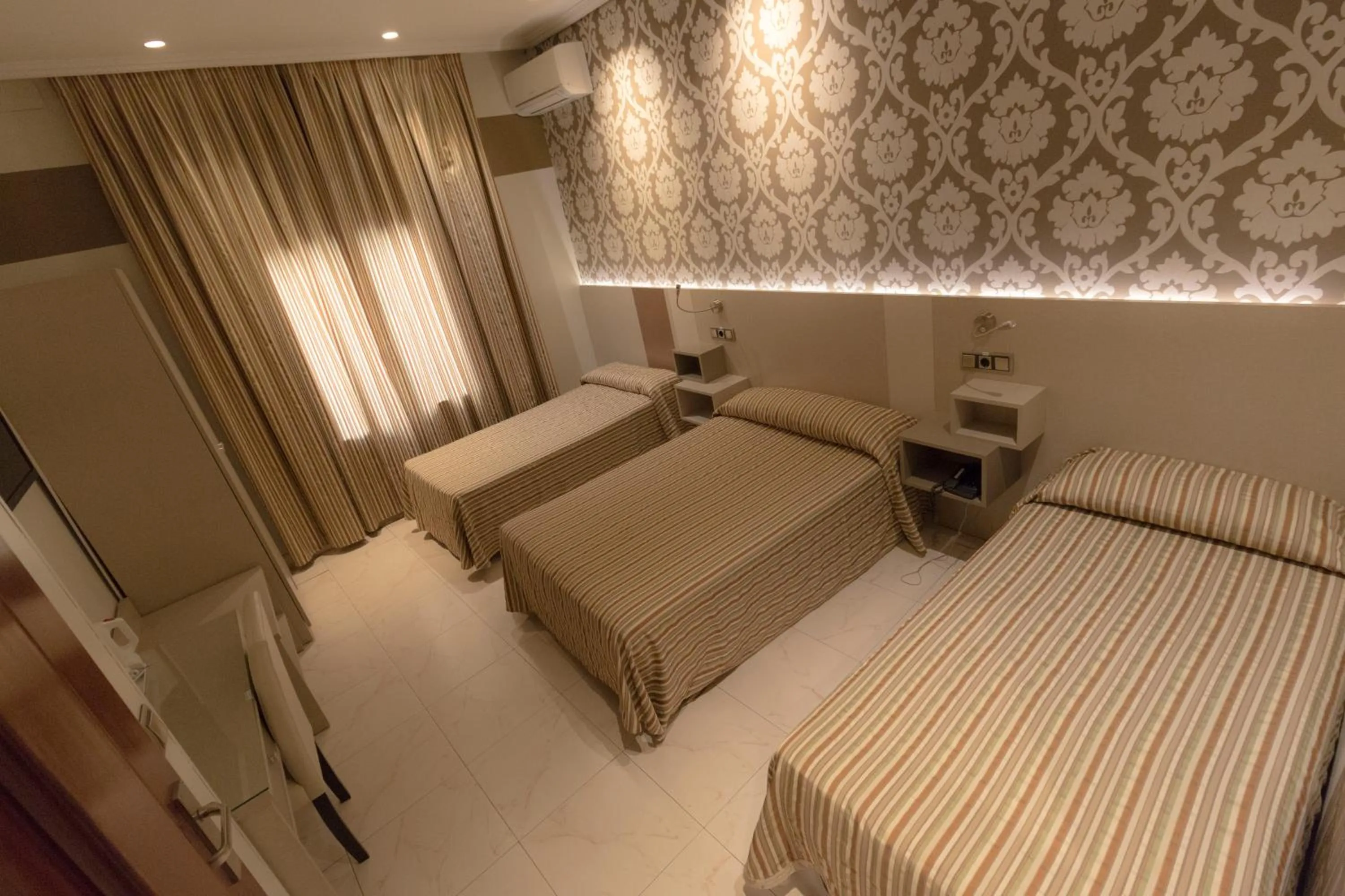 Bed in Hostal Atocha Almudena Martín